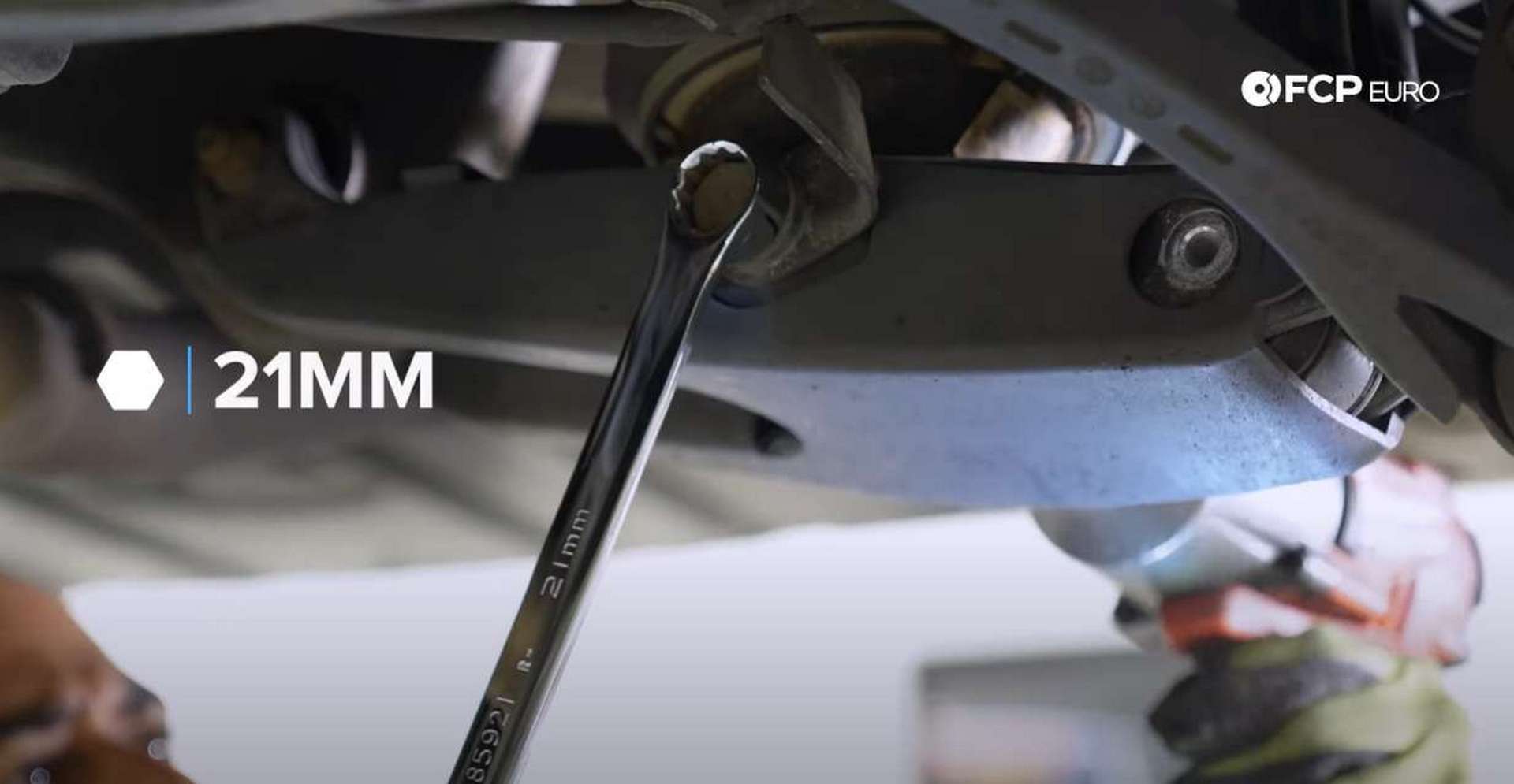 DIY Mercedes AIRMATIC Spring Replacement removing the lower air-spring bolt]