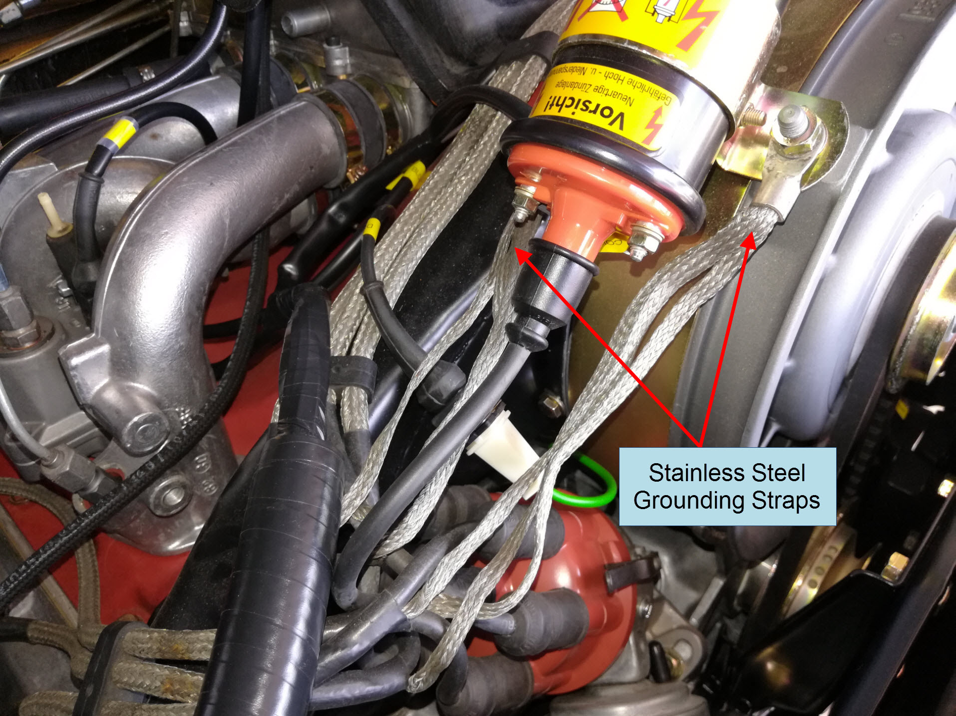 Air-cooled Porsche 911 spark plug wire stainless steel grounding straps.
