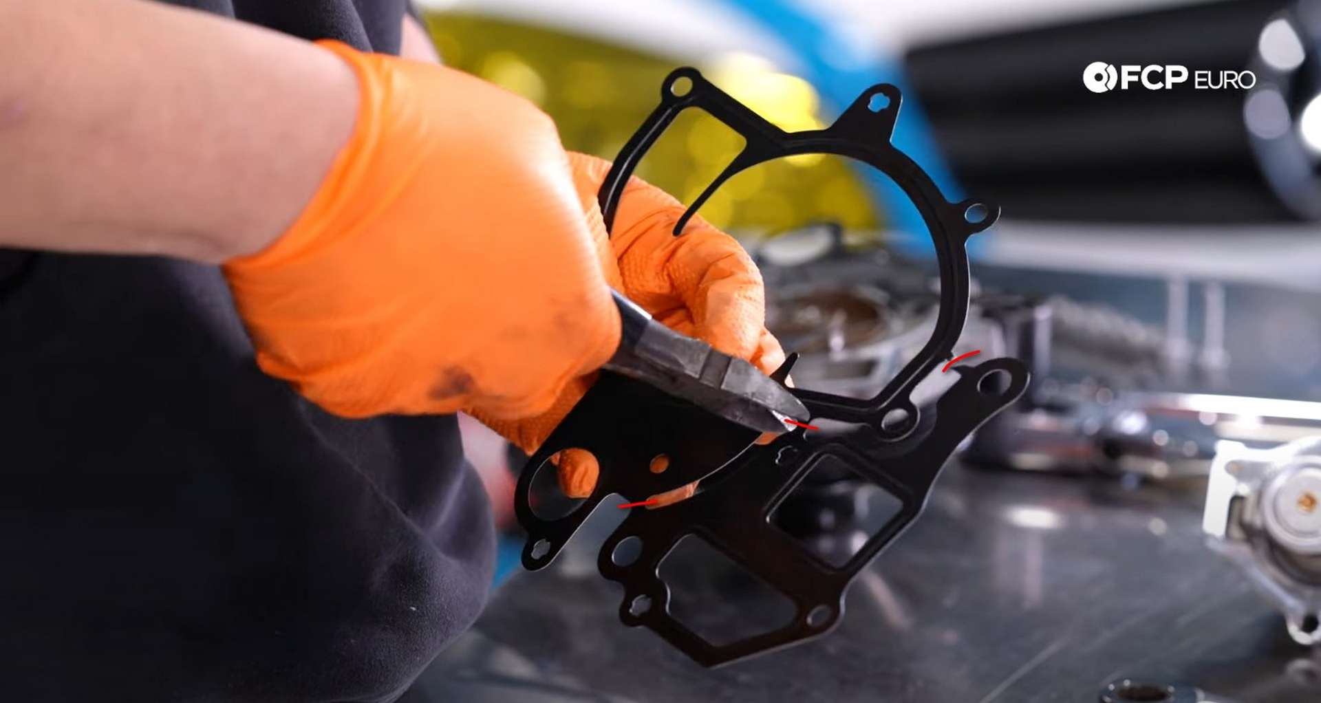 DIY Porsche 996 911 Water Pump And Thermostat Replacement cutting the water pump gasket
