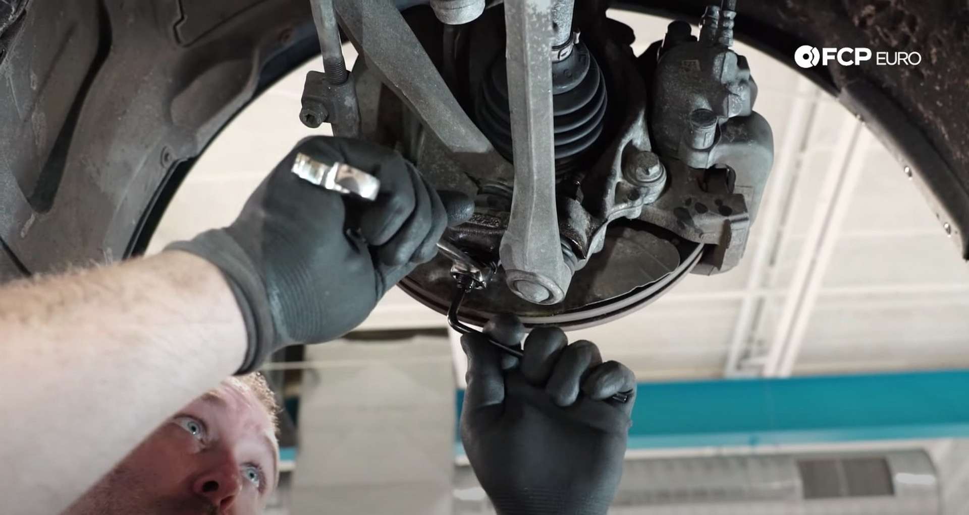 DIY BMW F30 Front Control Arm Replacement removing the thrust arm's ball joint nut
