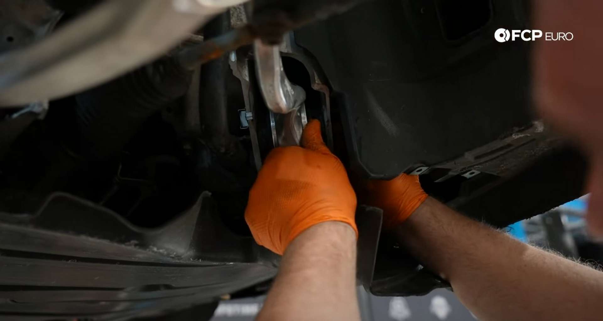 DIY BMW E9X Front Control Arm Upgrade installing the tension rod’s inner mounting bolt