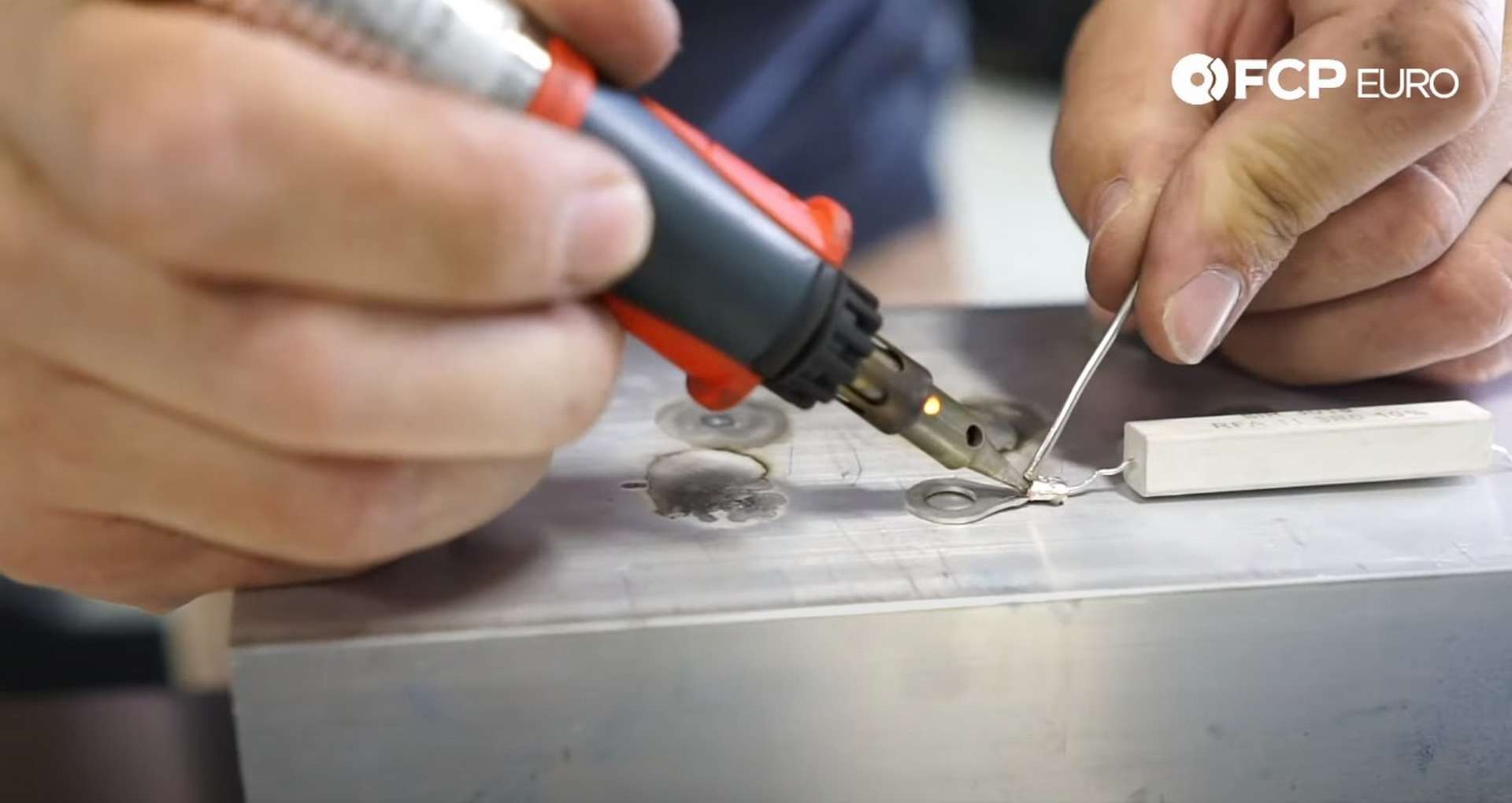DIY Battery Relocation soldering a ring terminal to the resistor