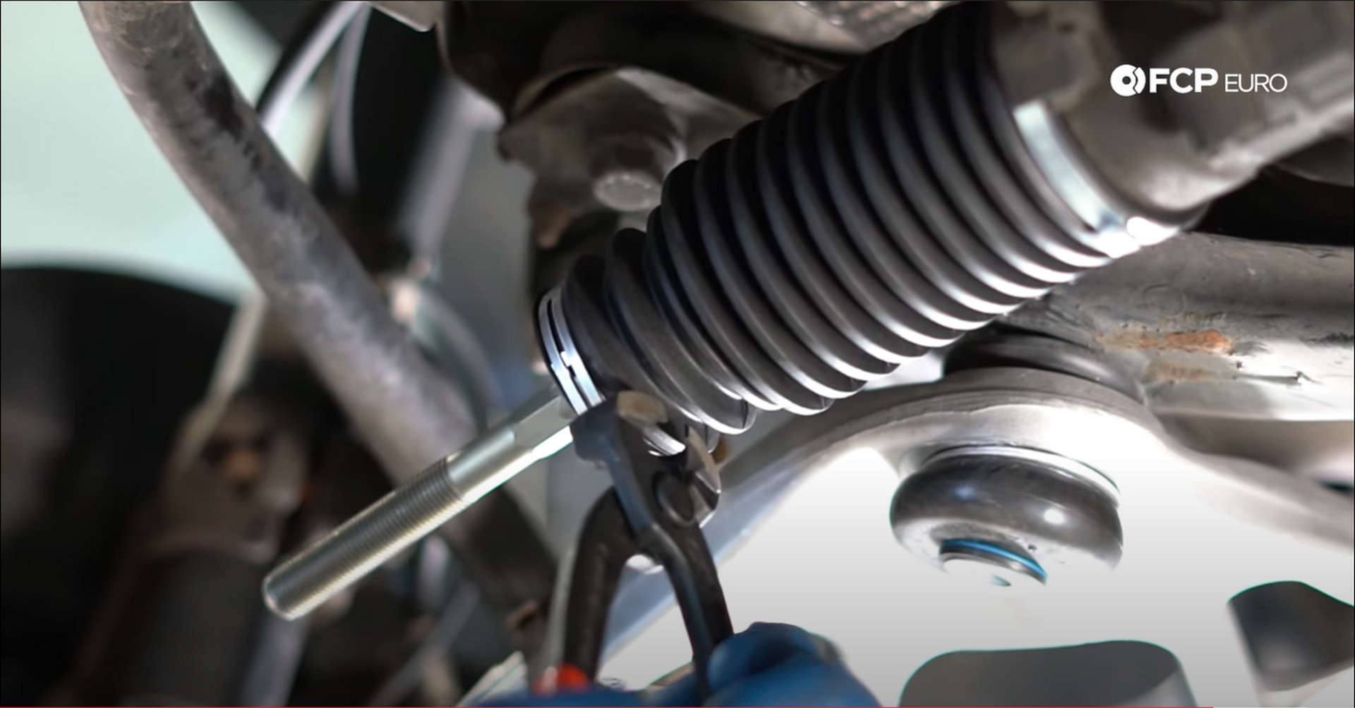 DIY BMW Front Suspension Refresh clamping the tie rod boot
