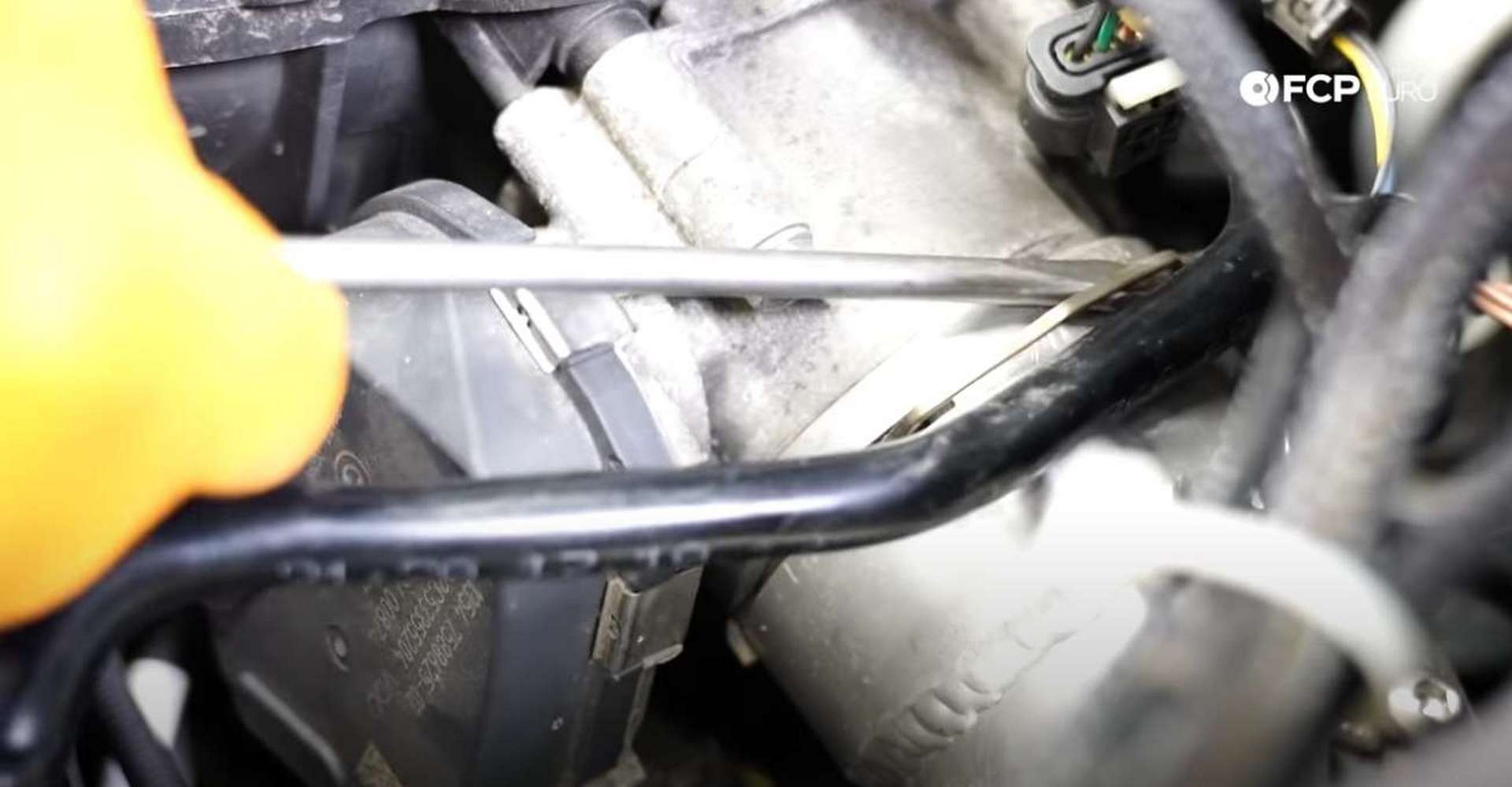 DIY BMW F30 Oil Filter Housing Gasket Replacement unlocking the charge pipe connection