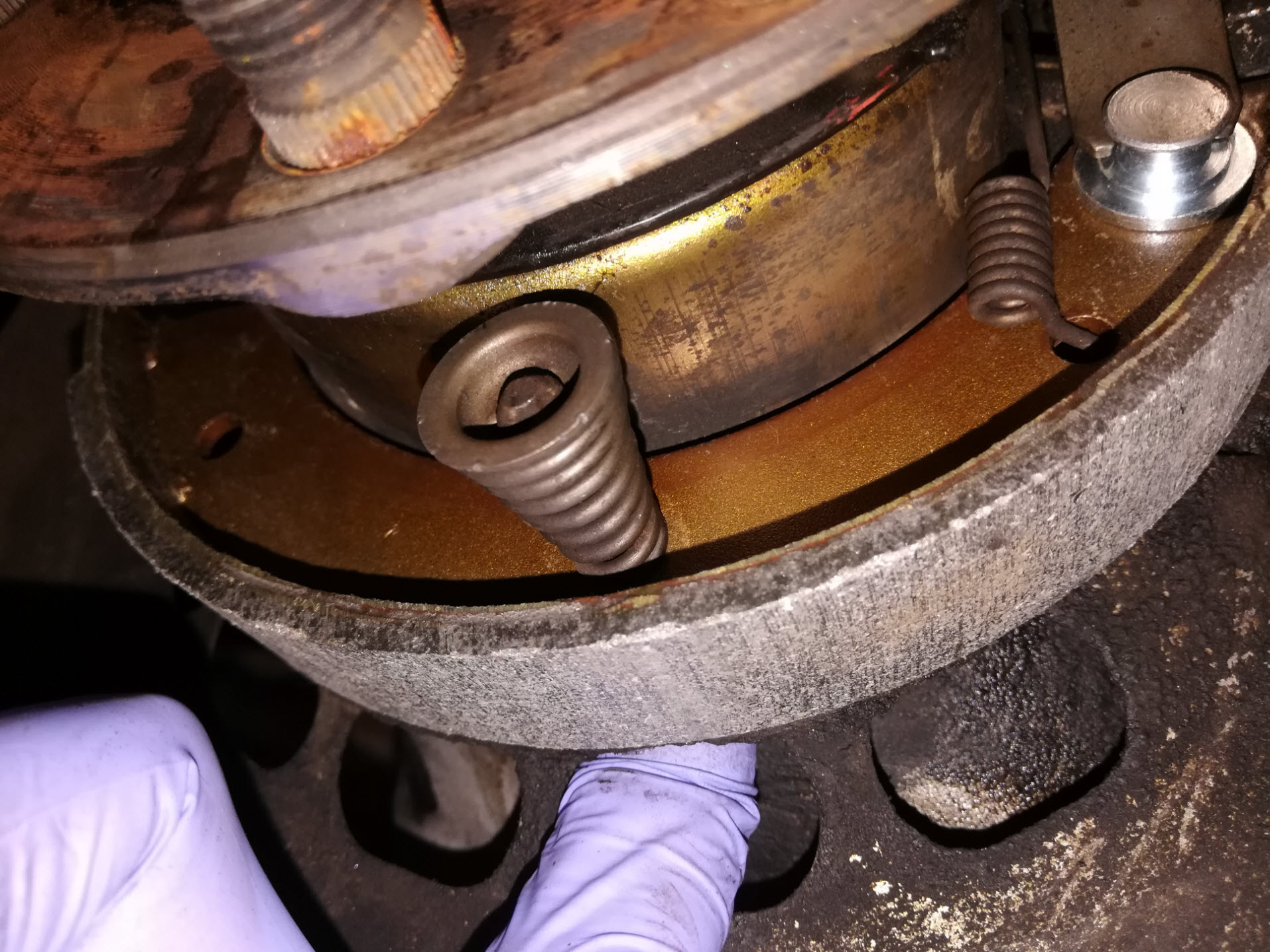 Air-cooled Porsche 911 parking brake spring reassembly.