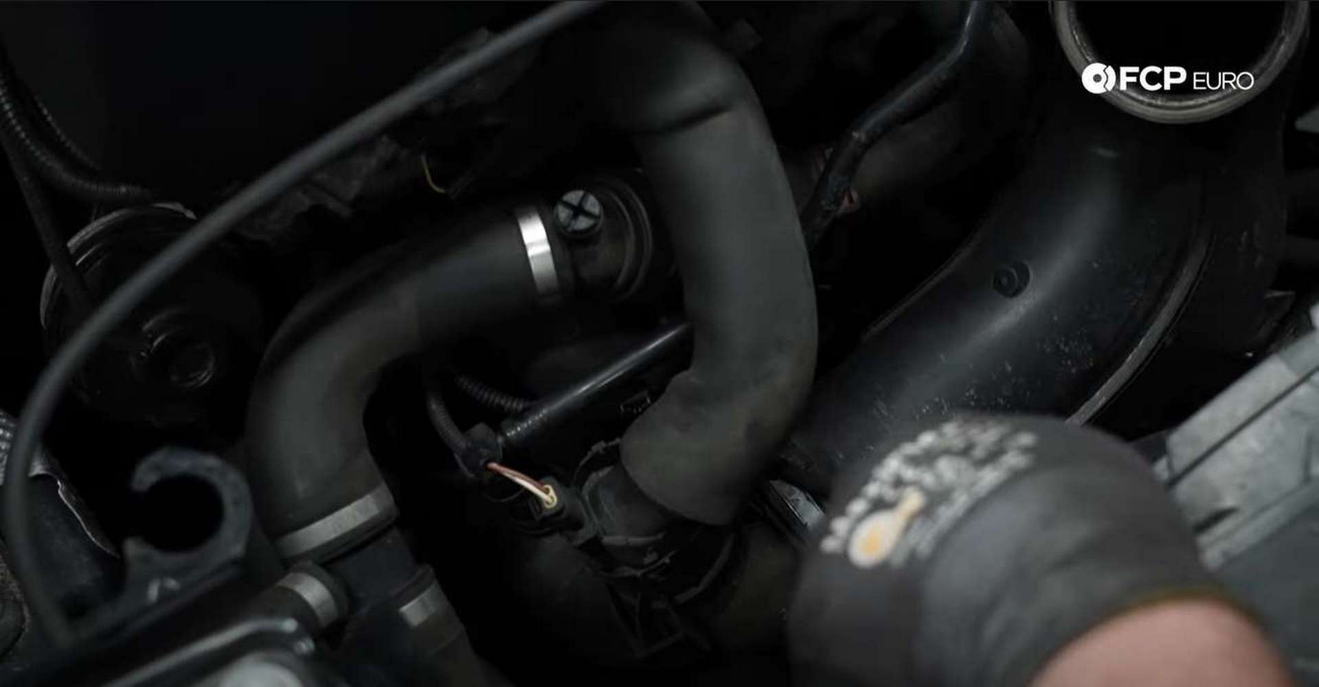 DIY BMW F30 Serpentine Belt Replacement loosening the intake tube’s hose clamp