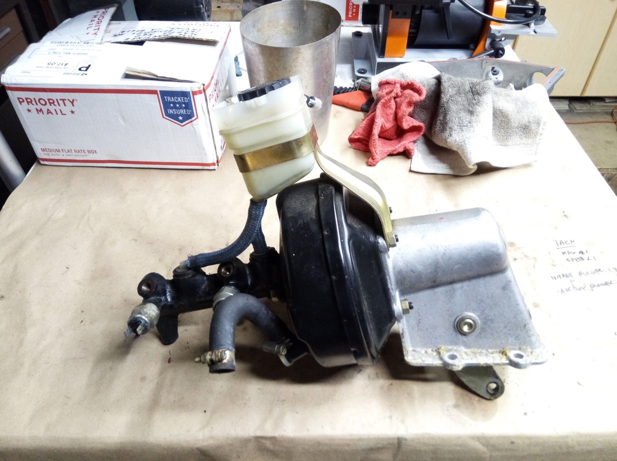 Air-cooled Porsche 911 master cylinder booster assembly.