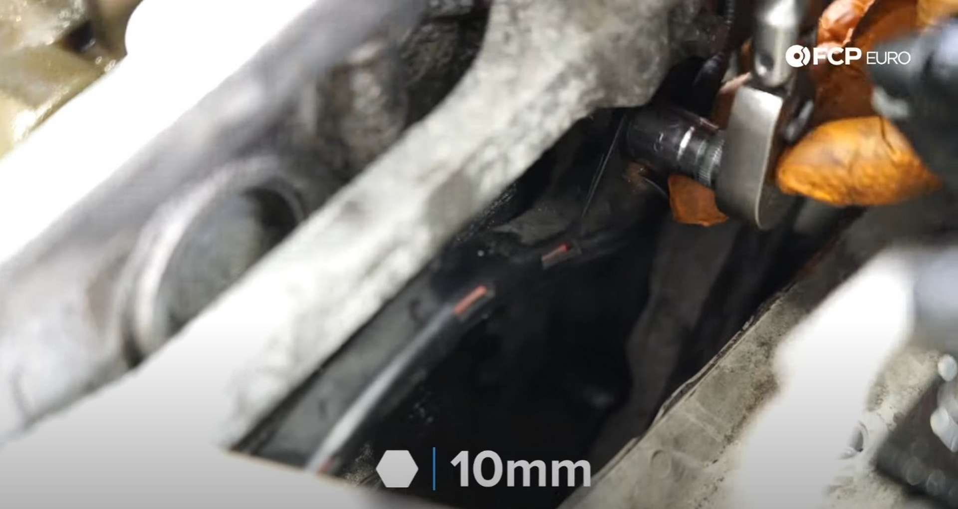 DIY MINI R56 Timing Chain Replacement securing the engine harness to the timing cover