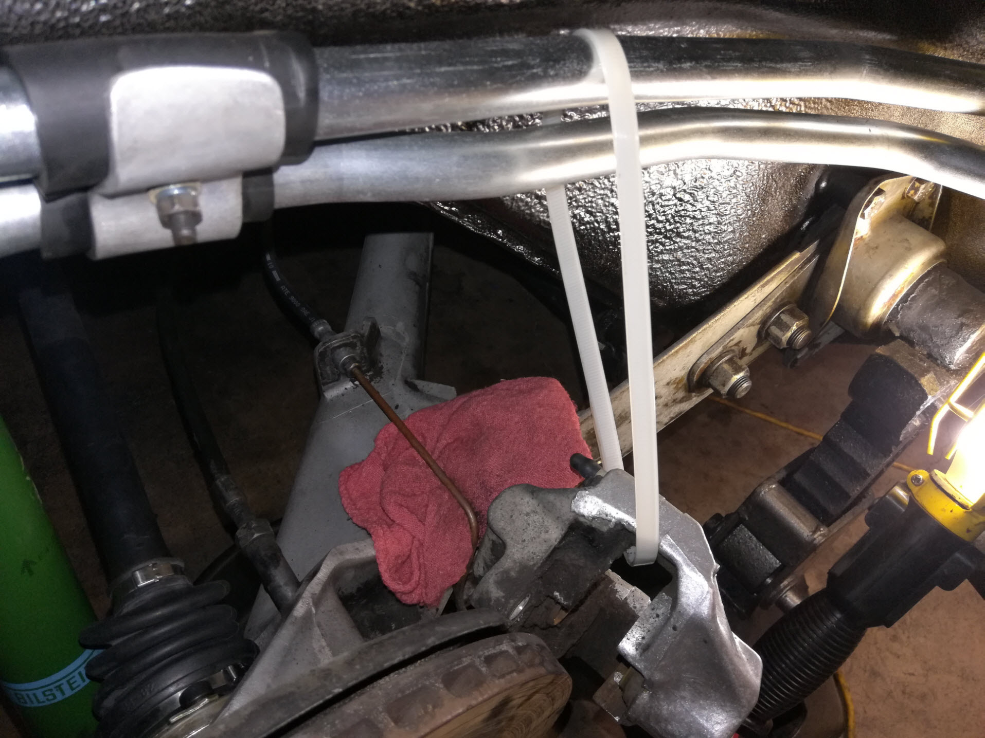 Air-cooled Porsche 911 rear brake caliper removal.