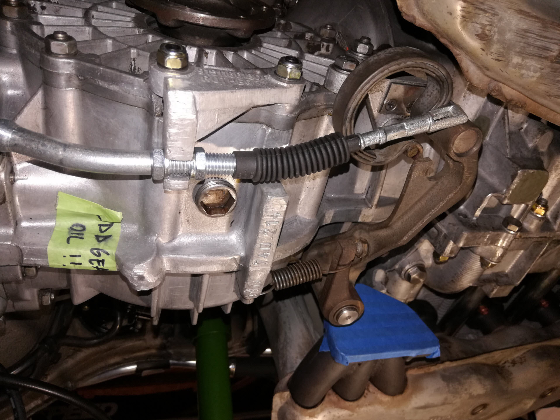 Air-cooled Porsche 911 clutch cable installation at gearbox.