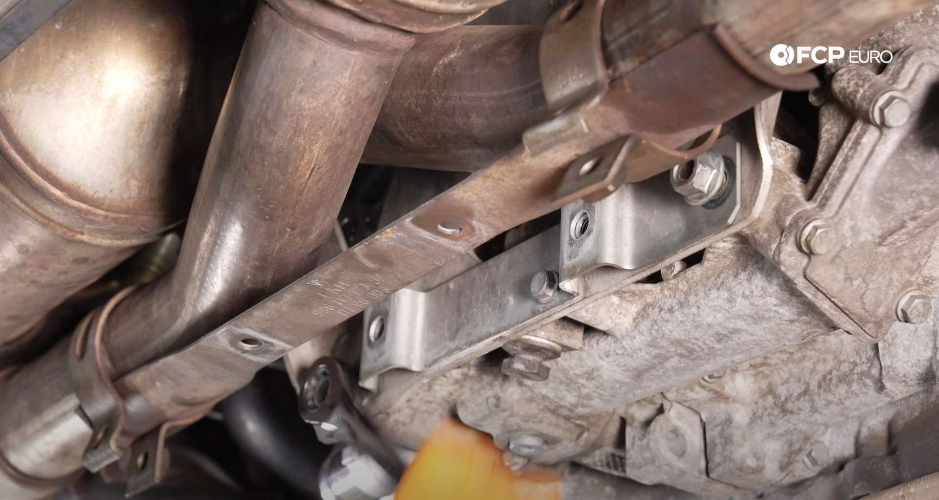 DIY Porsche 996 911 Water Pump And Thermostat Replacement installing the lower brace nuts