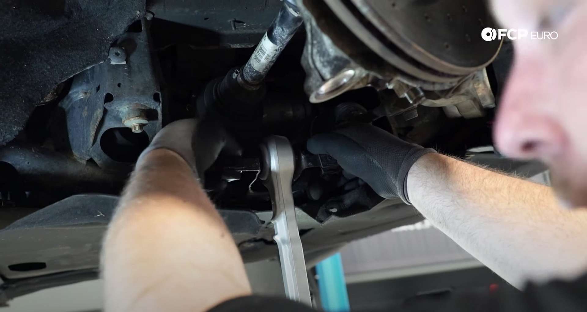 DIY BMW F30 Front Control Arm Replacement installing the lower control arm's inner bolt