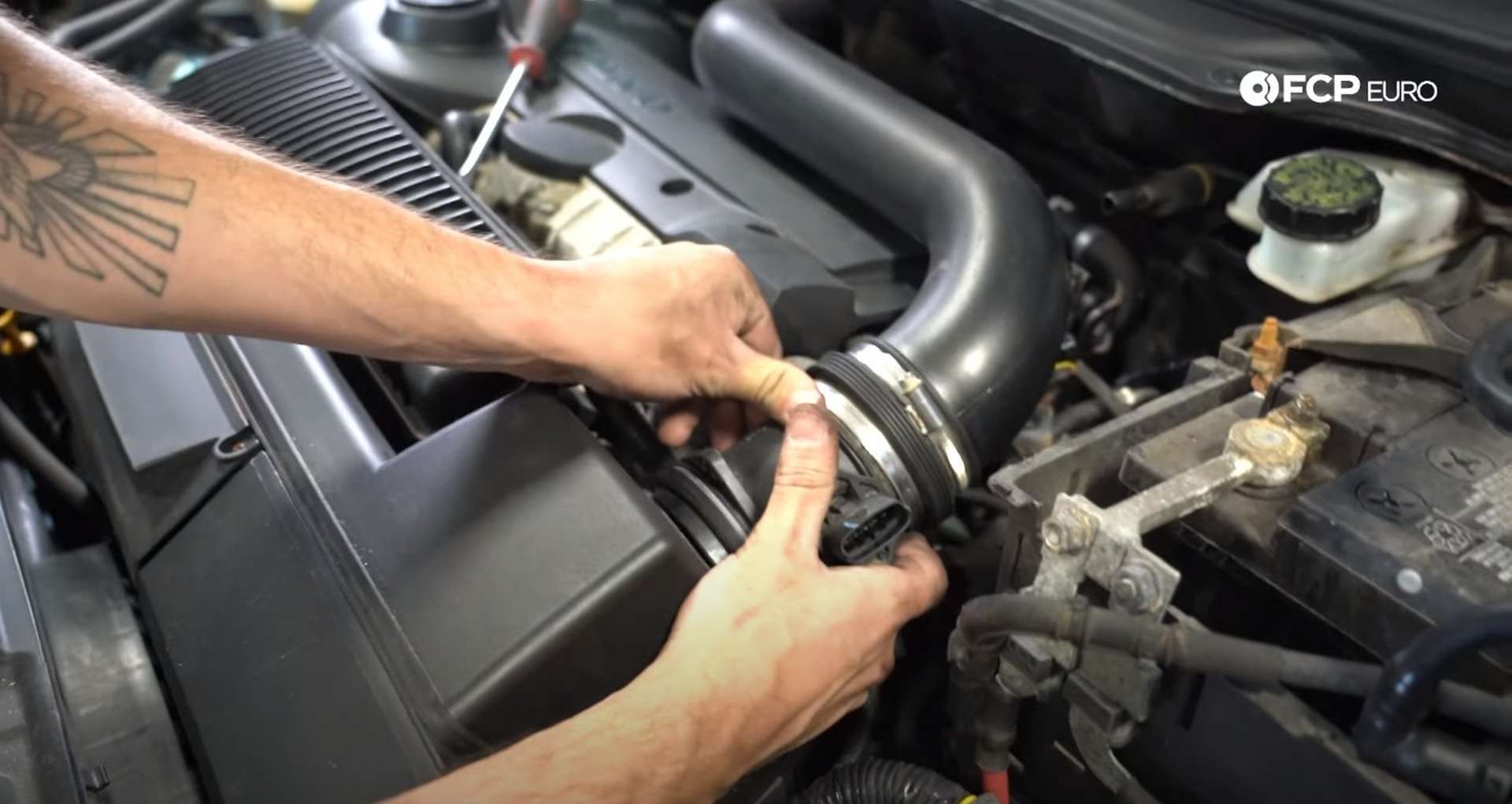 DIY Volvo Alternator and Serpentine Belt Replacement removing mass airflow sensor housing from the airbox