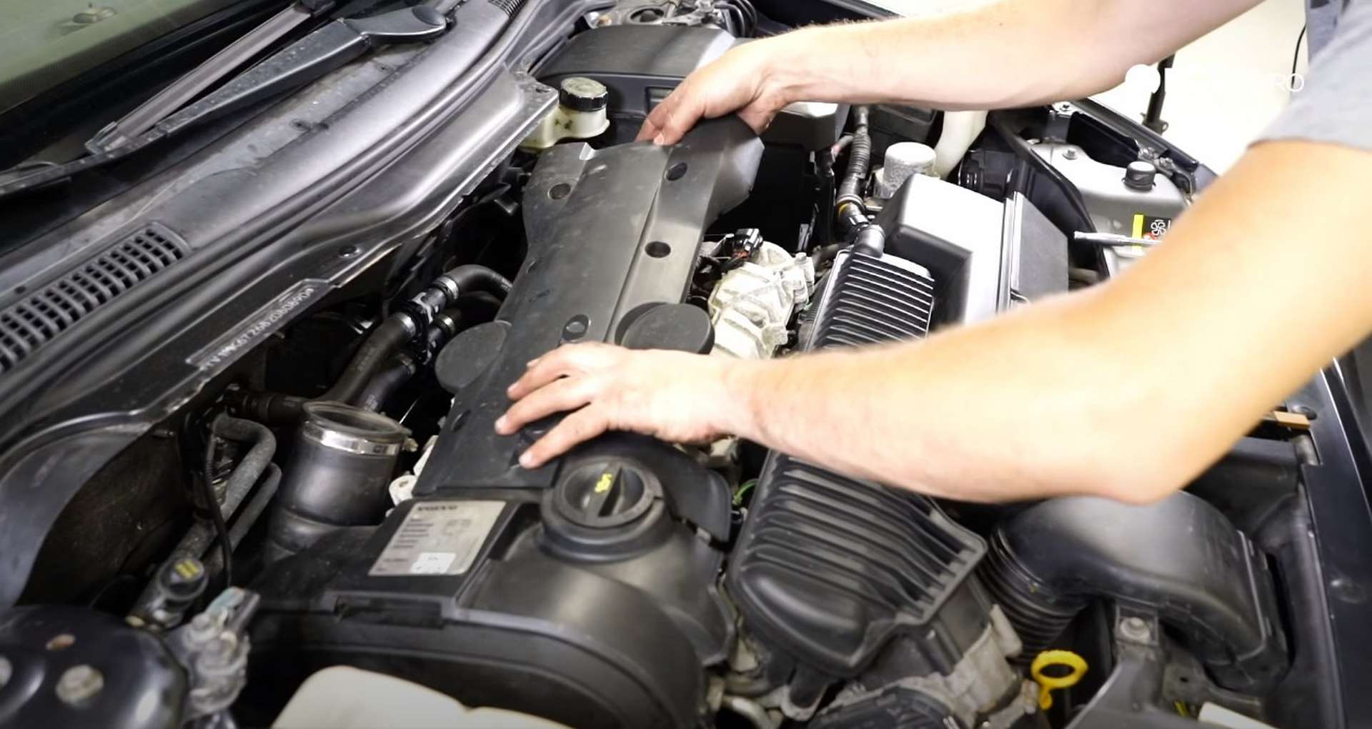 DIY Volvo P1 Timing Belt Replacement reinstalling the ignition coil cover
