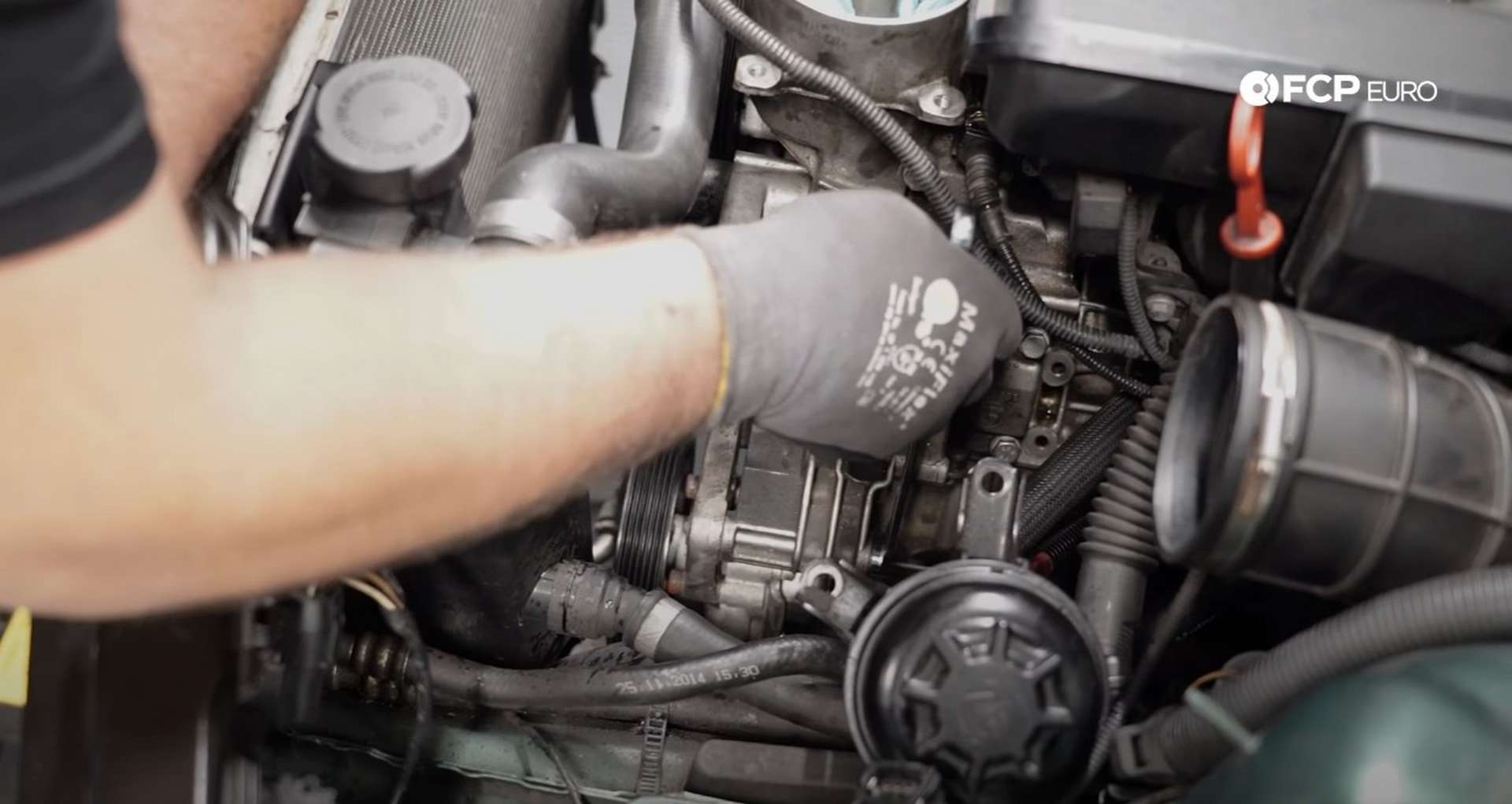 DIY BMW E46 Oil Filter Housing Gasket and VANOS Line Replacement tightening the power steering pump bolts