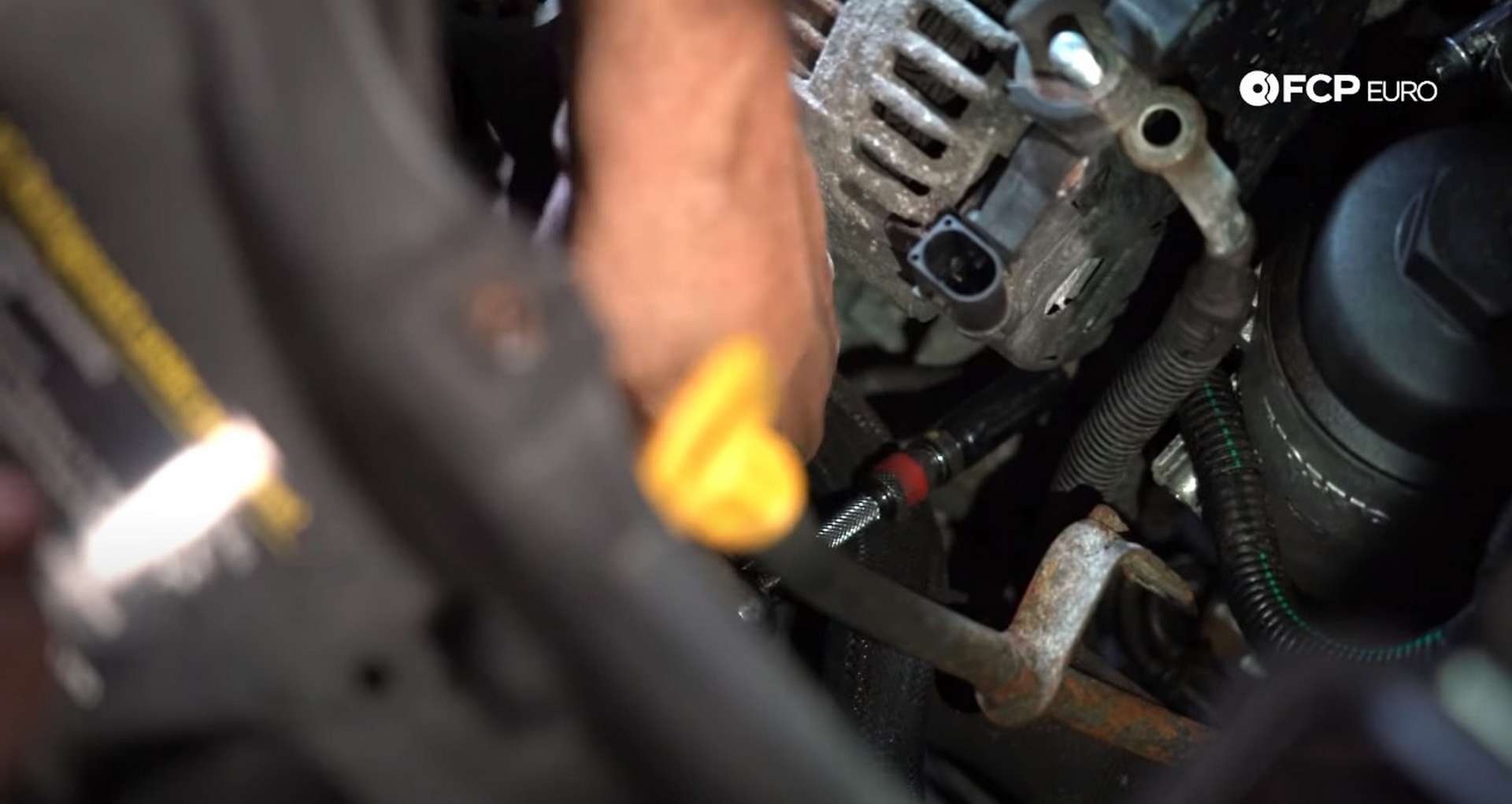 DIY Volvo Alternator and Serpentine Belt Replacement removing the bottom alternator mounting bolt