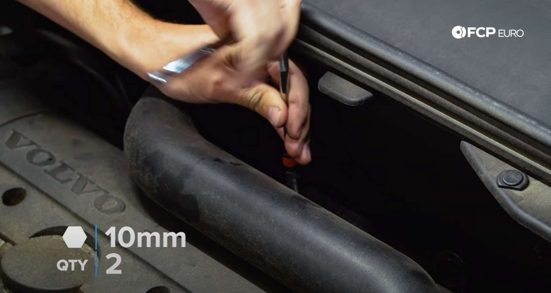 DIY Volvo Spark Plug and Ignition Coil Replacement removing the intake pipe mountng