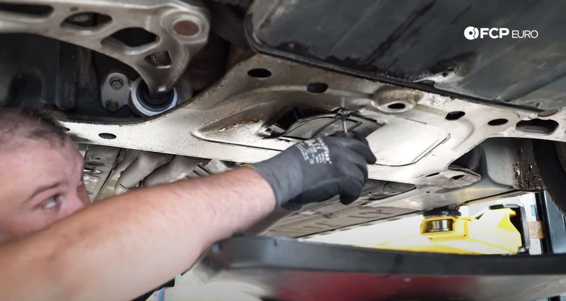 DIY BMW E46 Oil Filter Housing Gasket and VANOS Line Replacement removing the oil drain cover