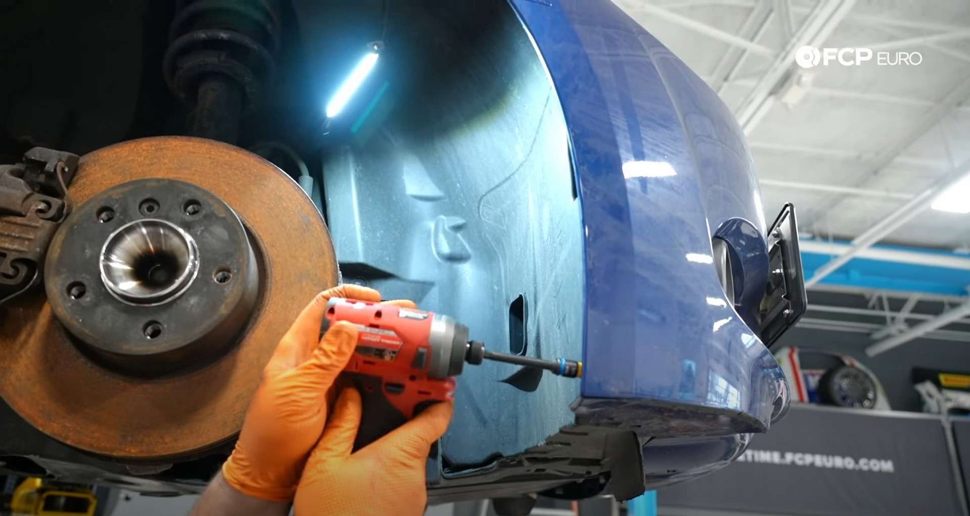 DIY BMW E9X Front Control Arm Upgrade removing the fender liner fasteners