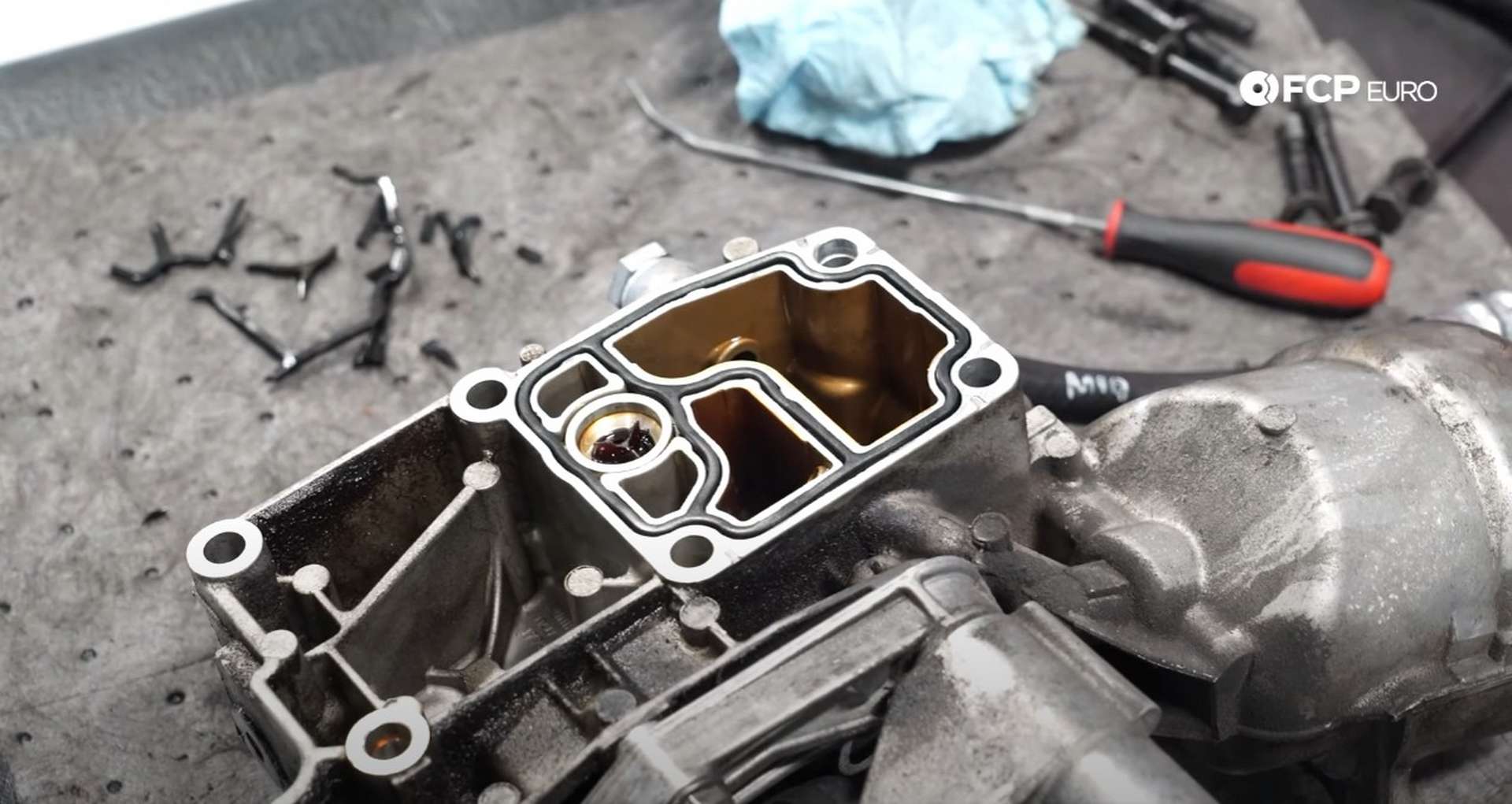 DIY BMW E46 Oil Filter Housing Gasket and VANOS Line Replacement the new gasket installed in the housing