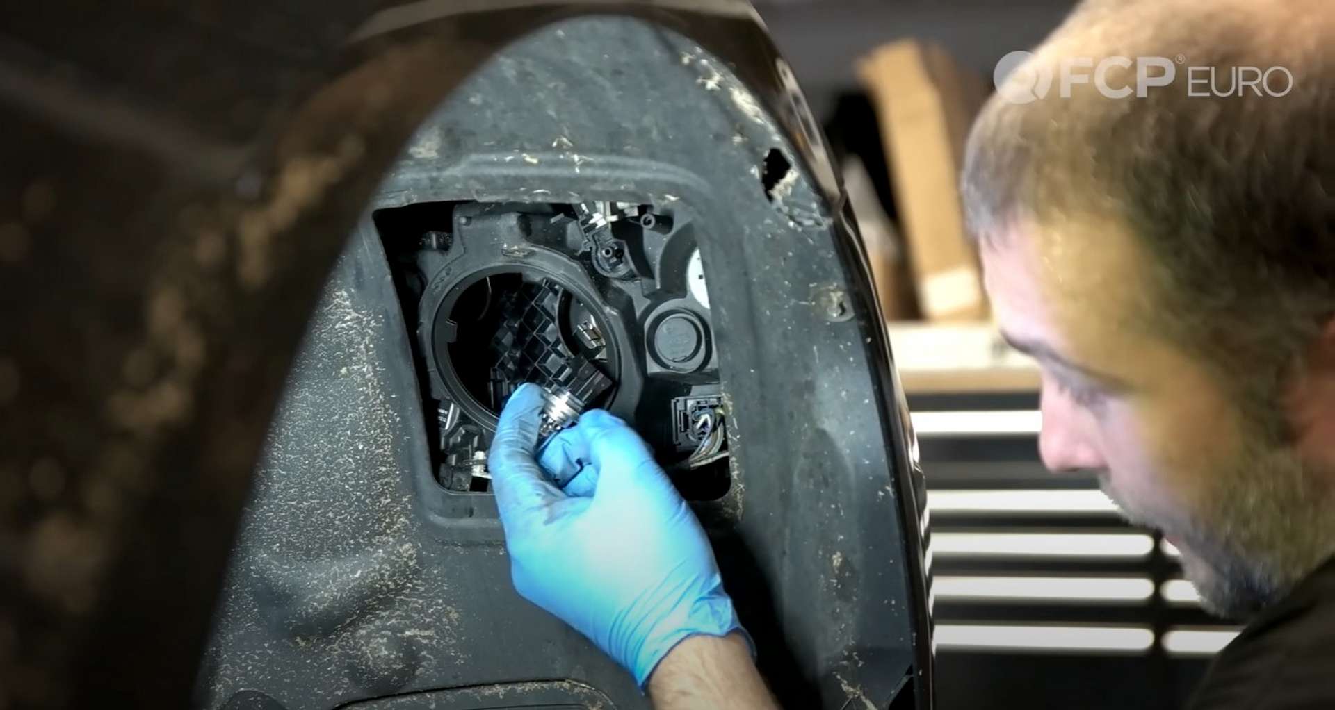 DIY BMW F30 Headlight Bulb Replacement separating the bulb from the harness