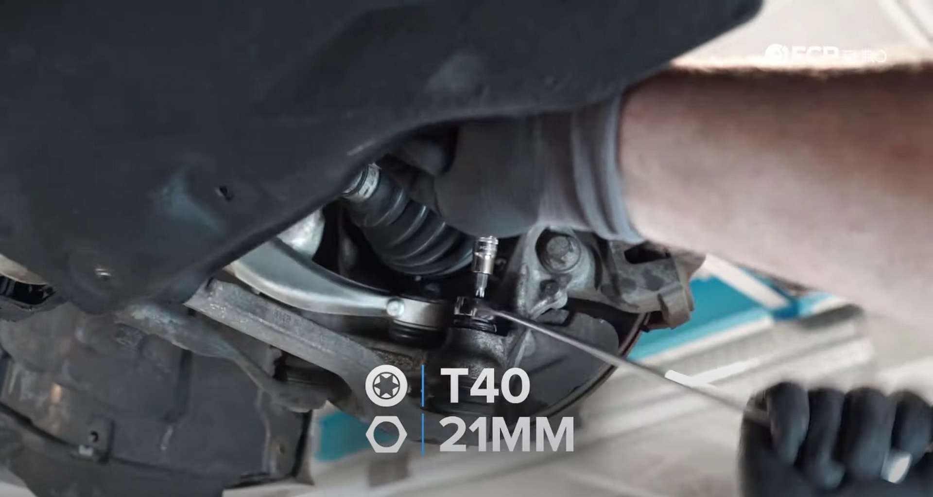 DIY BMW F30 Front Control Arm Replacement removing the nut from the lower arm's ball joint
