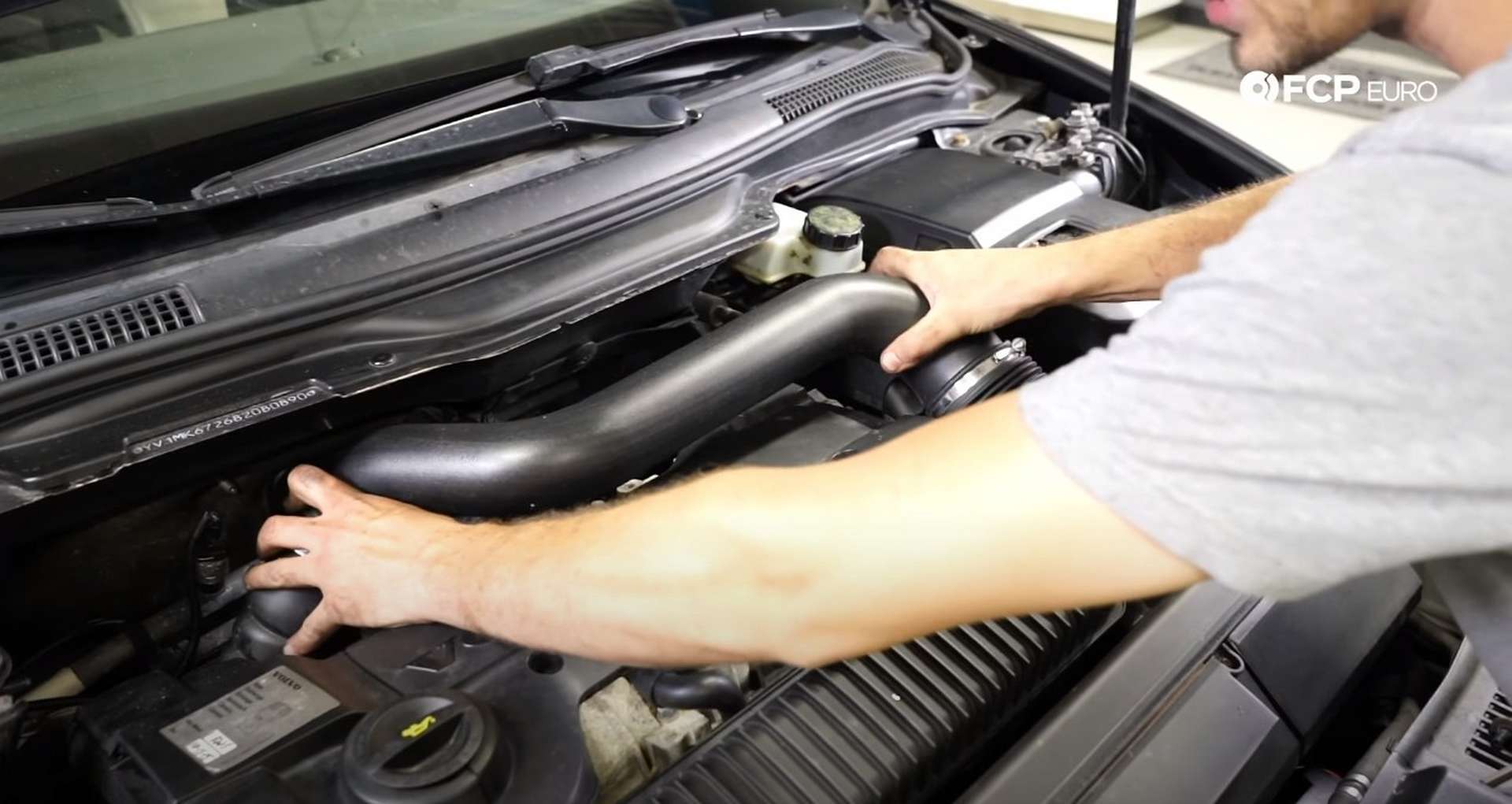 DIY Volvo P1 Water Pump Replacement installing the intake tube