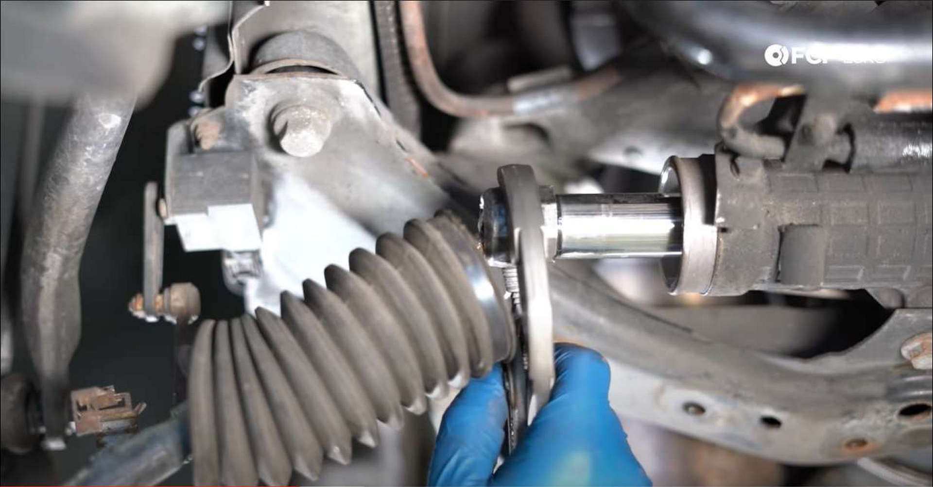 DIY BMW Front Suspension Refresh loosening the tie rod nut
