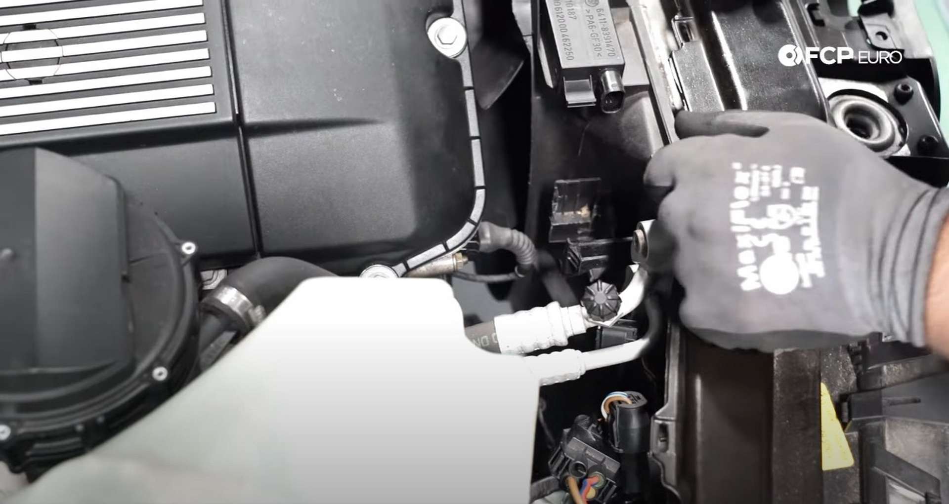 DIY BMW E46 Oil Filter Housing Gasket and VANOS Line Replacement moving the shroud wiring]