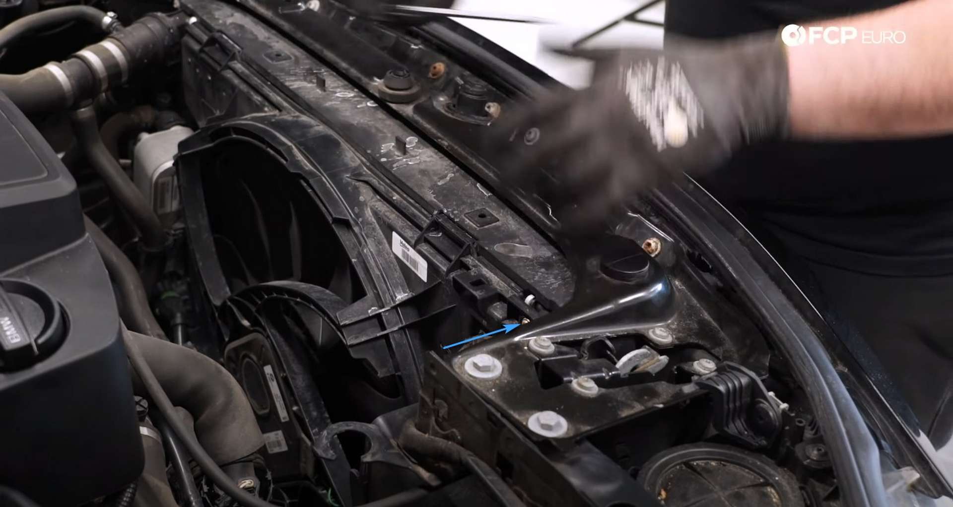 DIY BMW F30 Radiator Replacement loosening removing the transmission oil cooler fastener