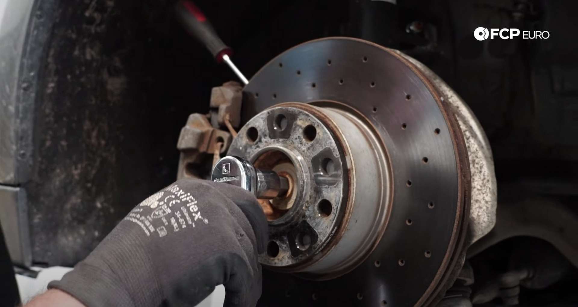DIY BMW F30 Front Control Arm Replacement removing the axle bolt