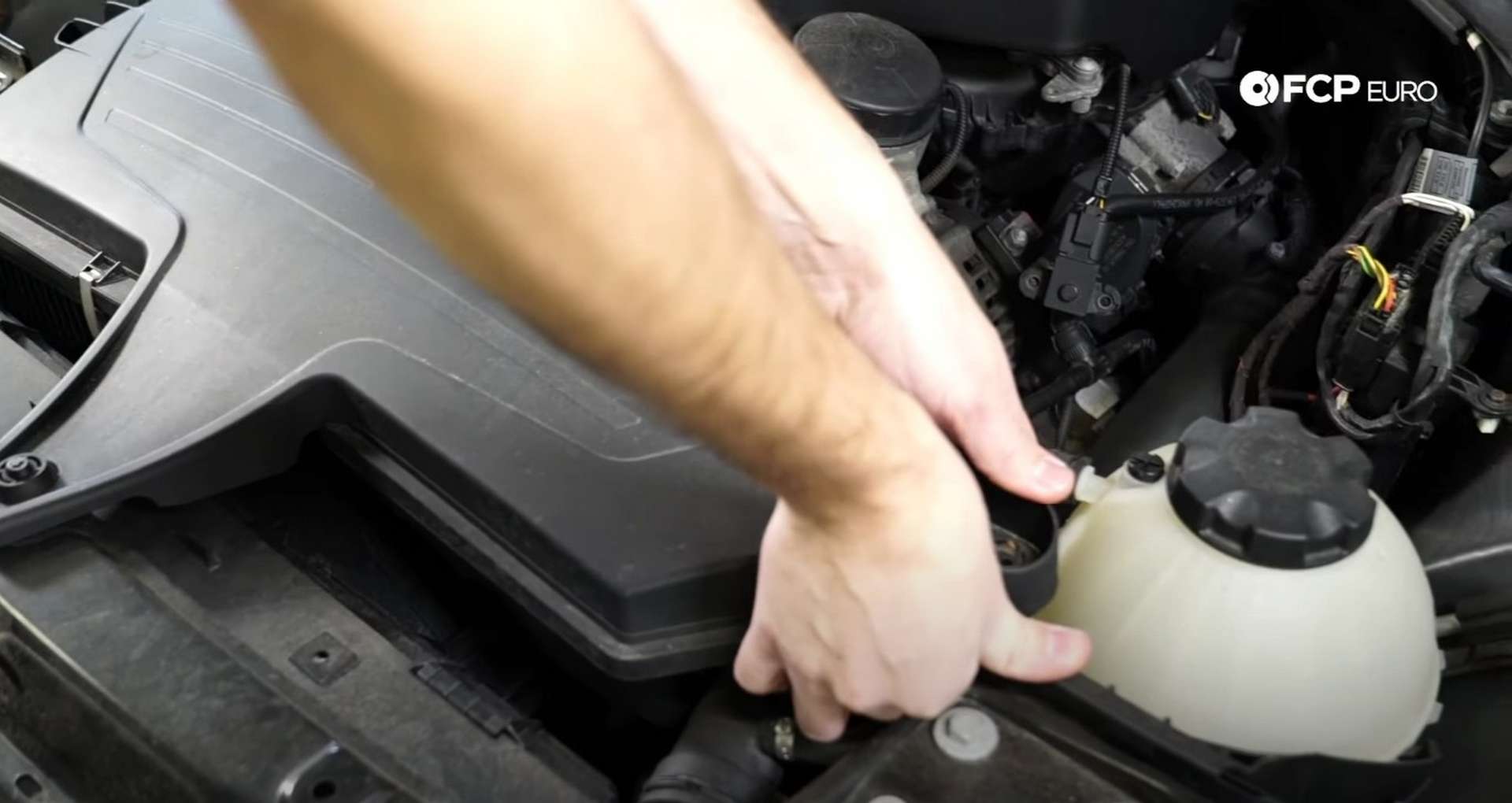 DIY BMW F30 Air Filter Replacement lifting the airbox cover off the grommets