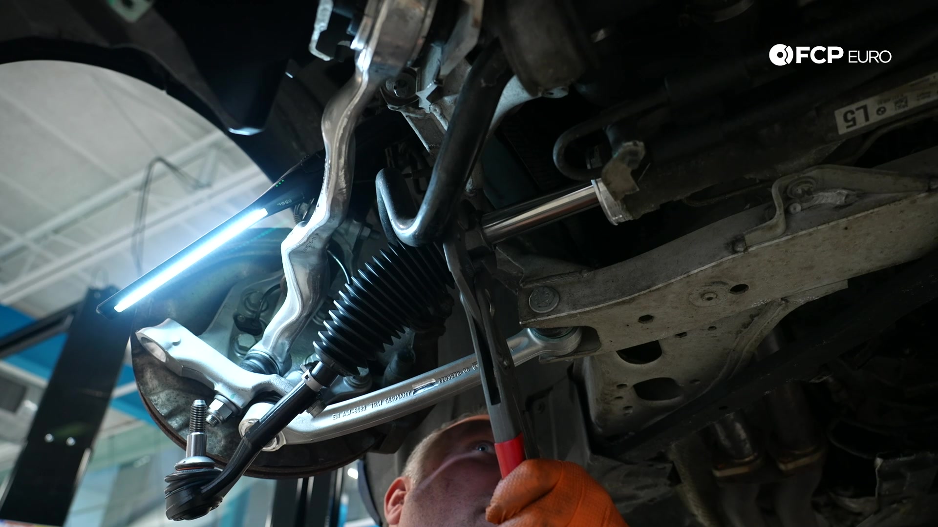 DIY BMW E90 Tie Rod Replacement installing the assembly in the rack