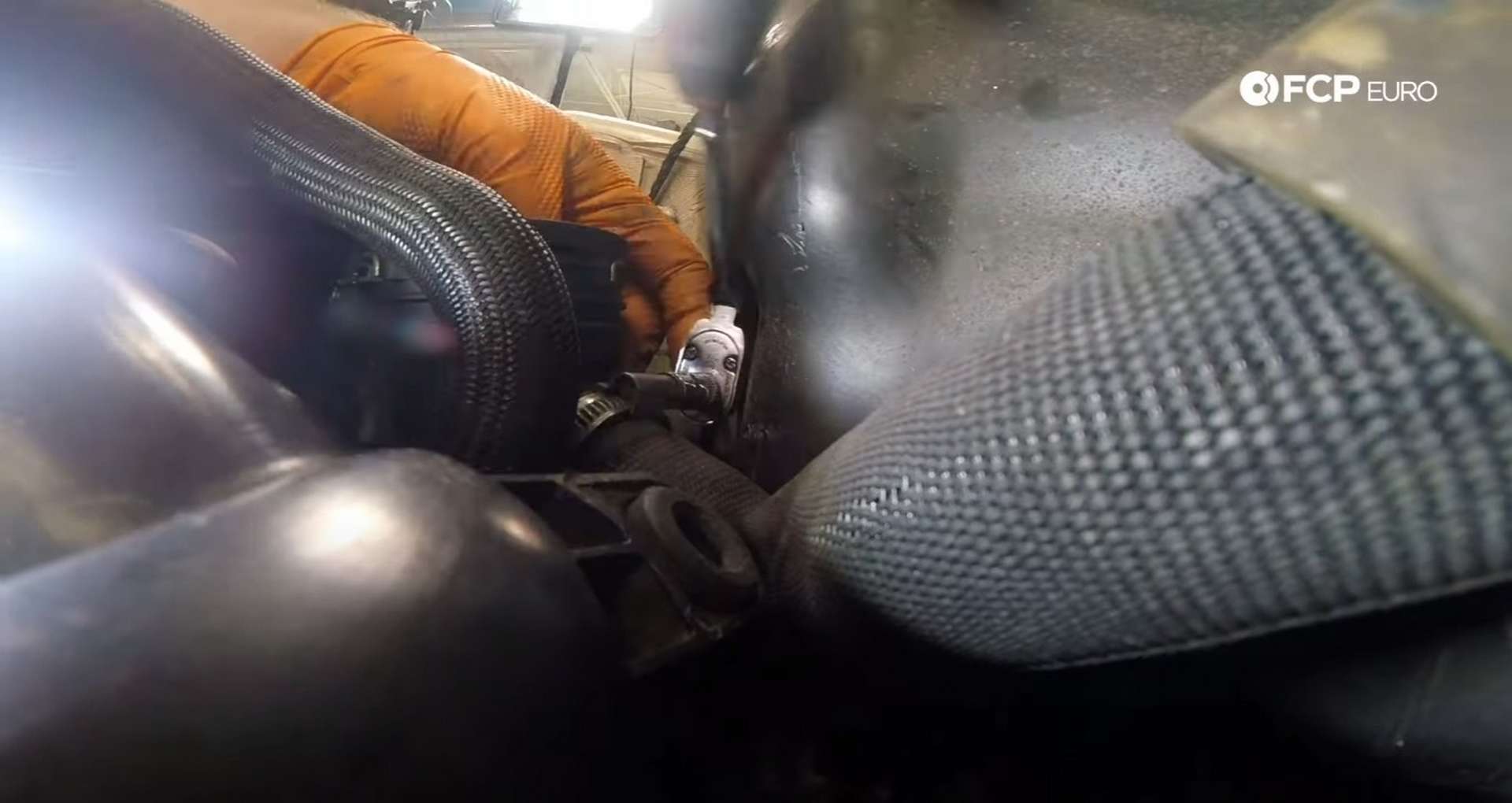 DIY MINI R56 Timing Chain Replacement loosening a hose clamp