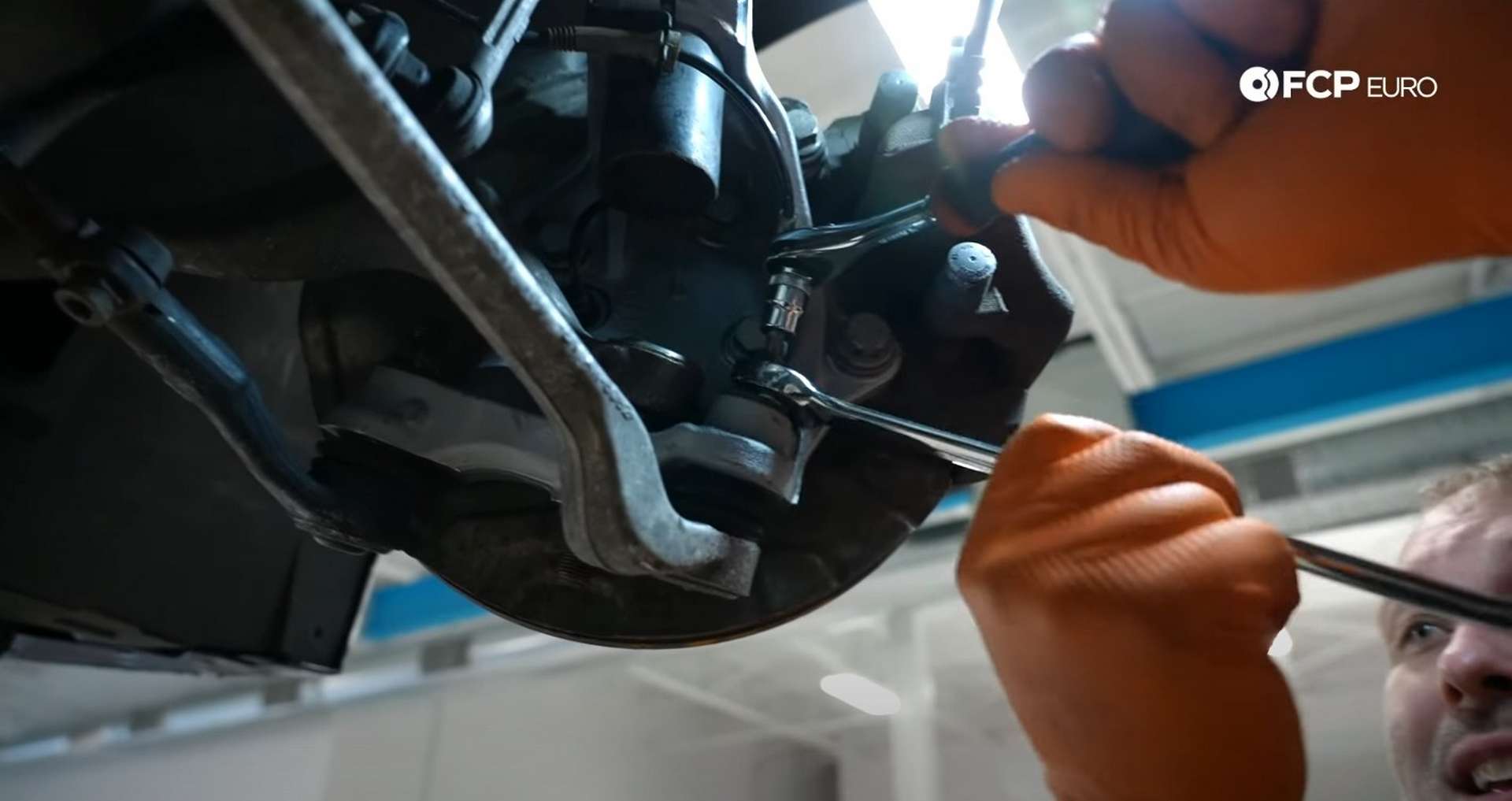 DIY BMW E9X Front Control Arm Upgrade removing the lower control arm ball joint’s nut