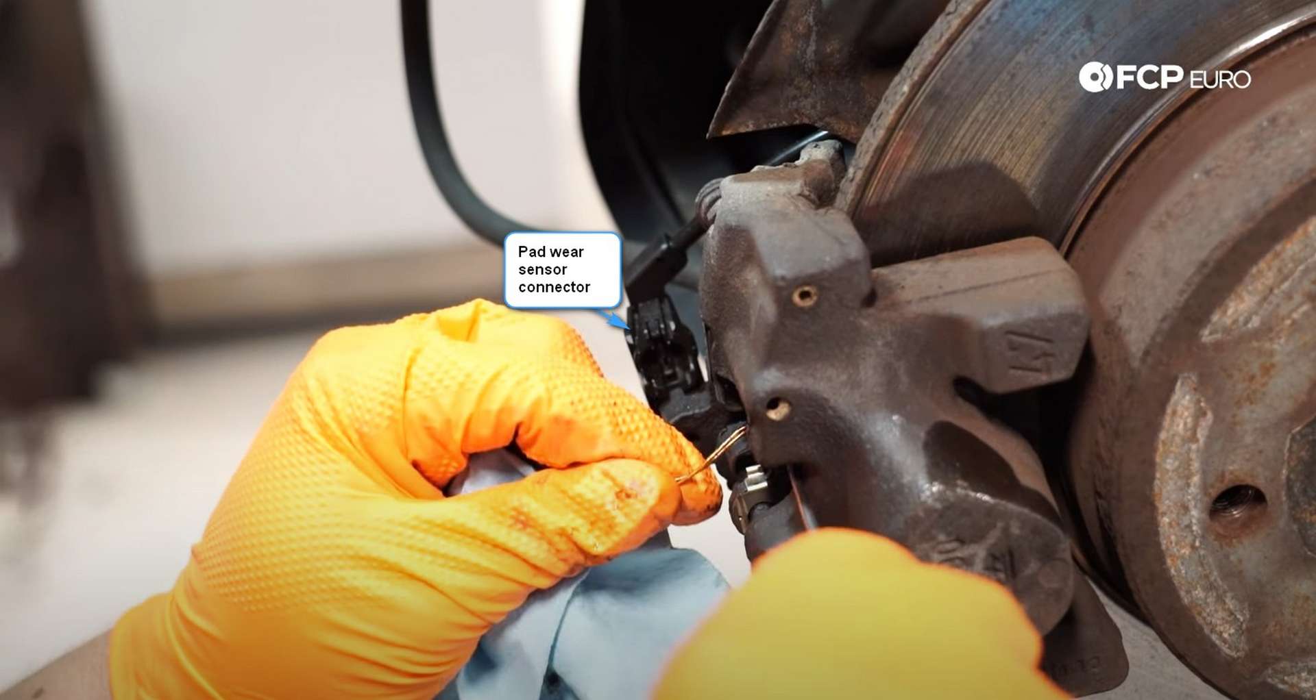 DIY Mercedes-Benz W203 Rear Brake Service removing the pad wear sensor