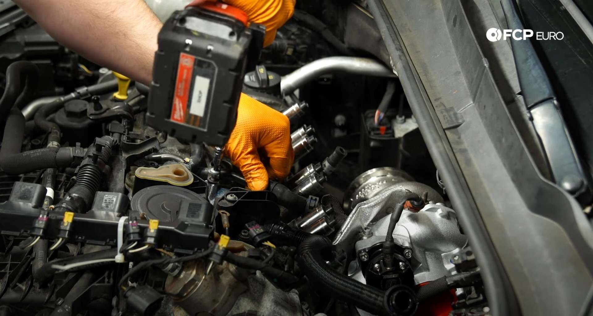 DIY MK7 VW GTI Turbocharger Upgrade tightening the coolant line bolts