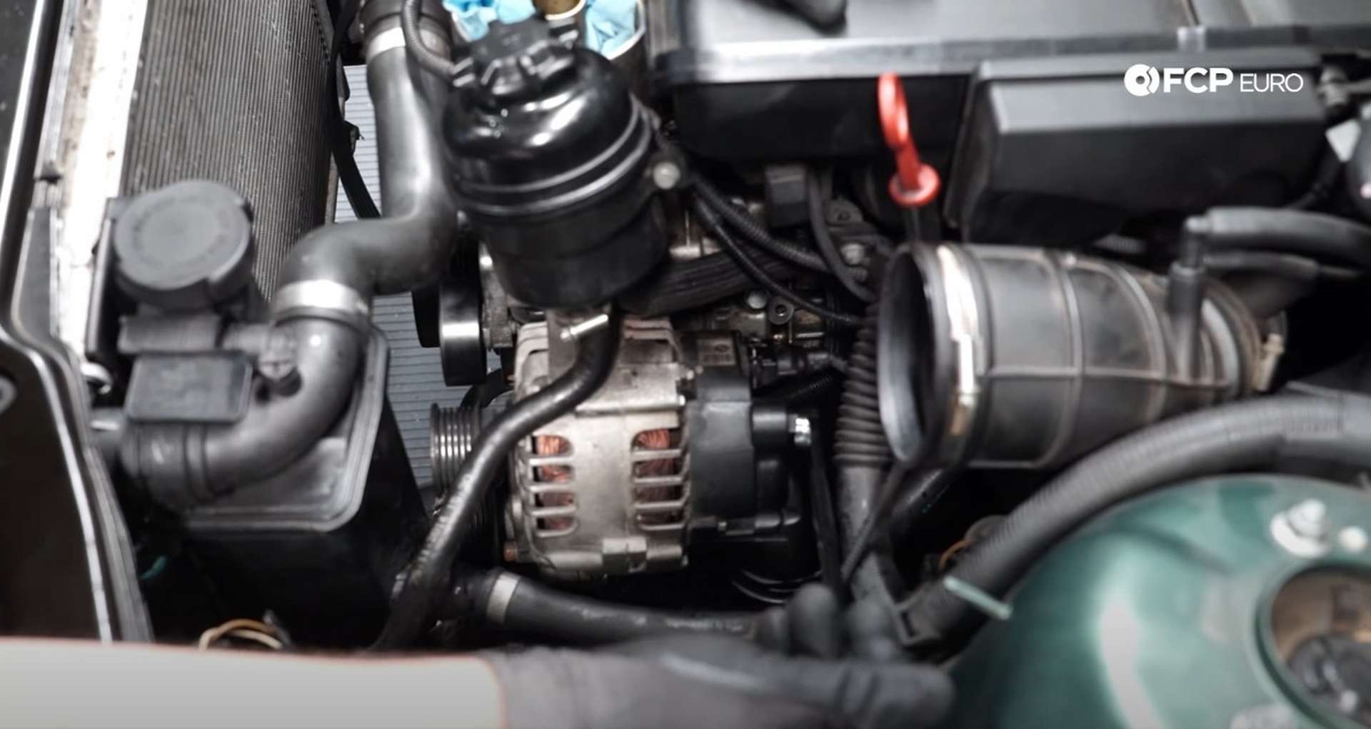 DIY BMW E46 Oil Filter Housing Gasket and VANOS Line Replacement tightening the plastic power lead nut