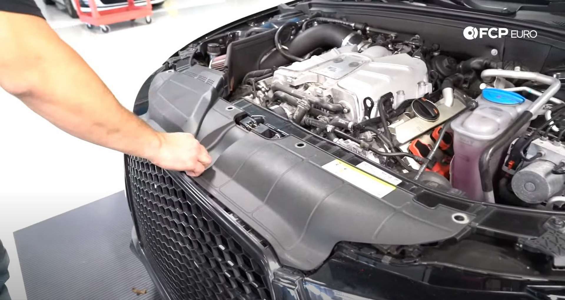 DIY Audi B8.5 Water Pump and Thermostat Replacement refitting the radiator shroud