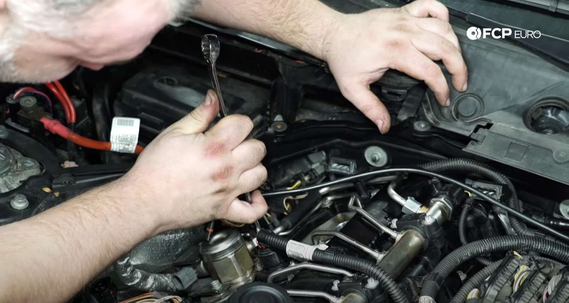 DIY BMW F30 Fuel Injector Replacement tightening the high-pressure fuel line connections