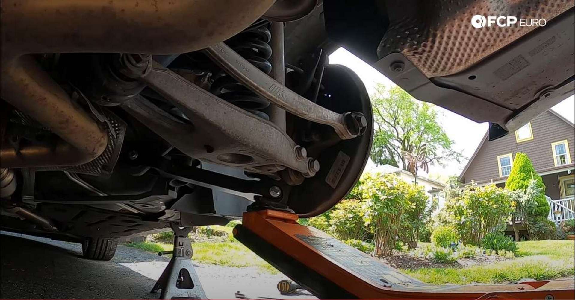 DIY BMW E90 Rear Trailing Arm supporting the suspension