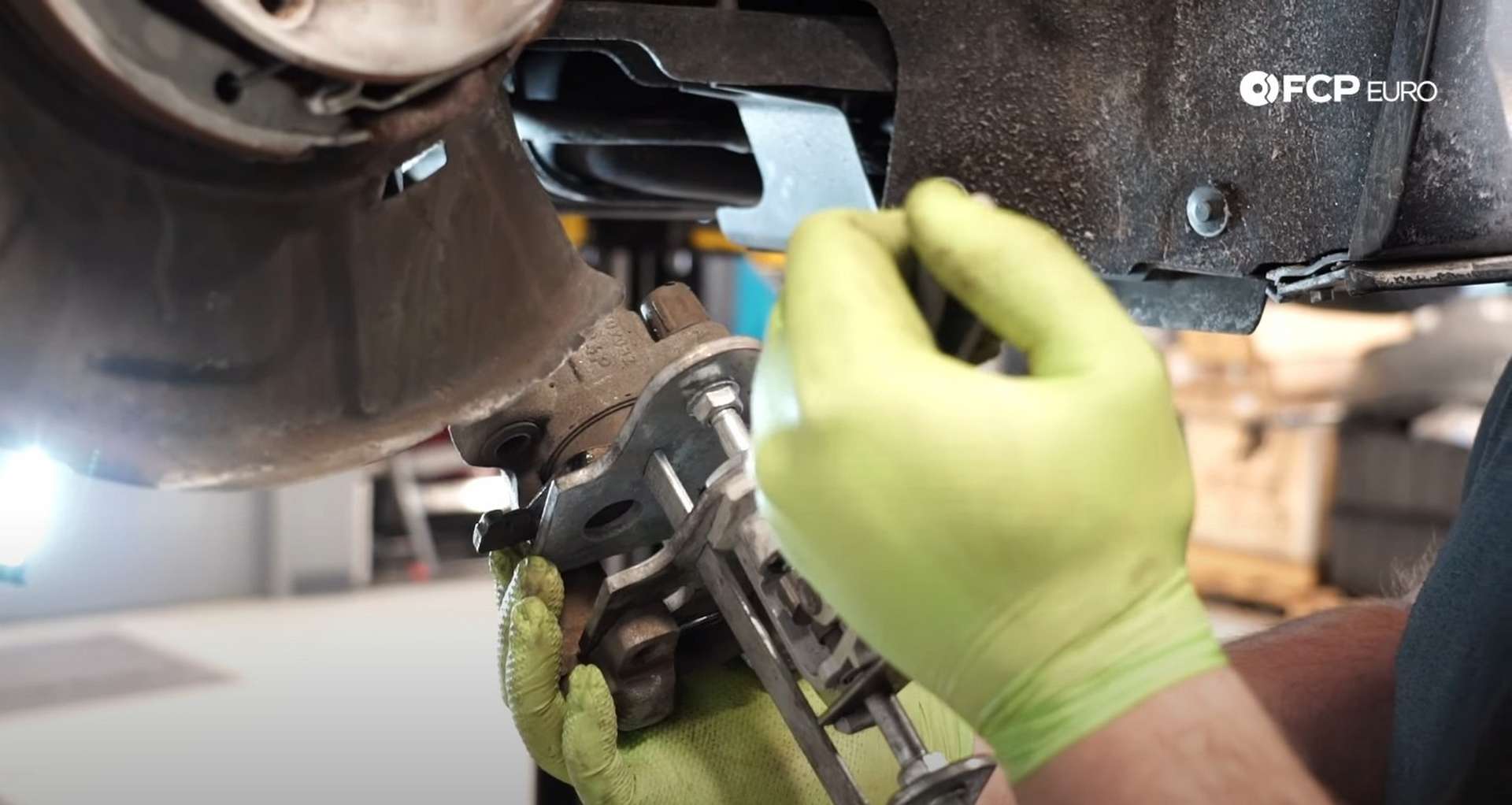 DIY BMW F30 Rear Brake Service compressing the caliper