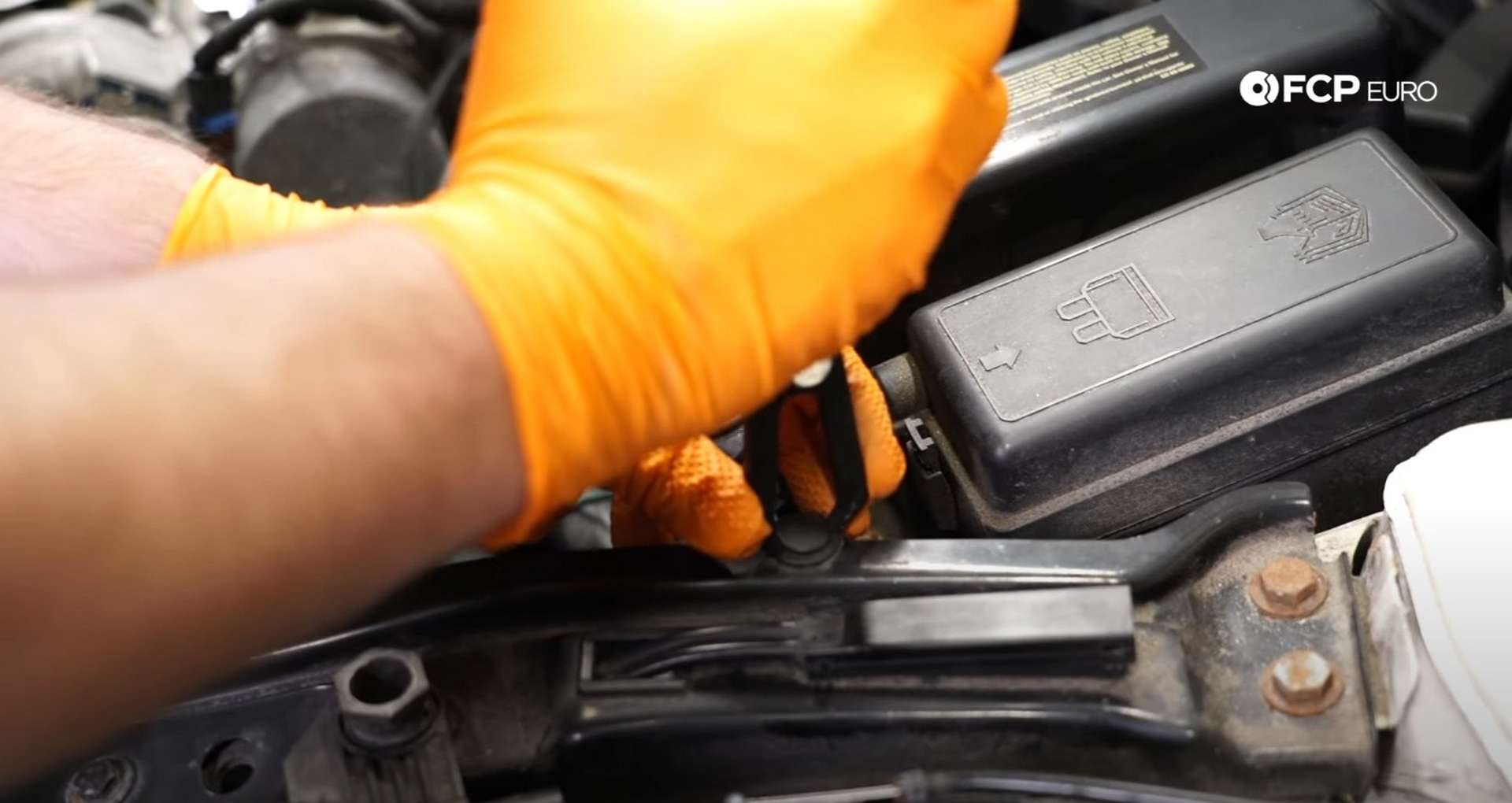 DIY MINI R56 Timing Chain Replacement removing the washer tank clip
