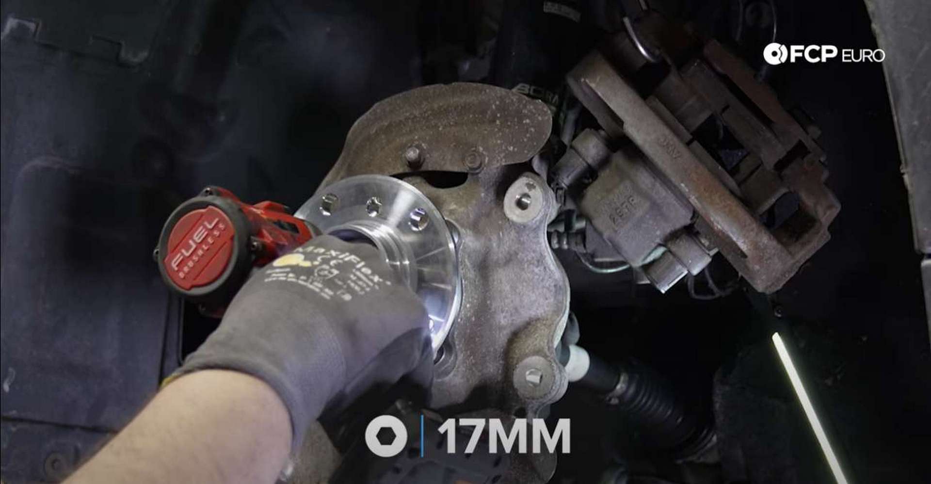 DIY BMW F30 Front Wheel Bearing Replacement driving in the new axle bolt