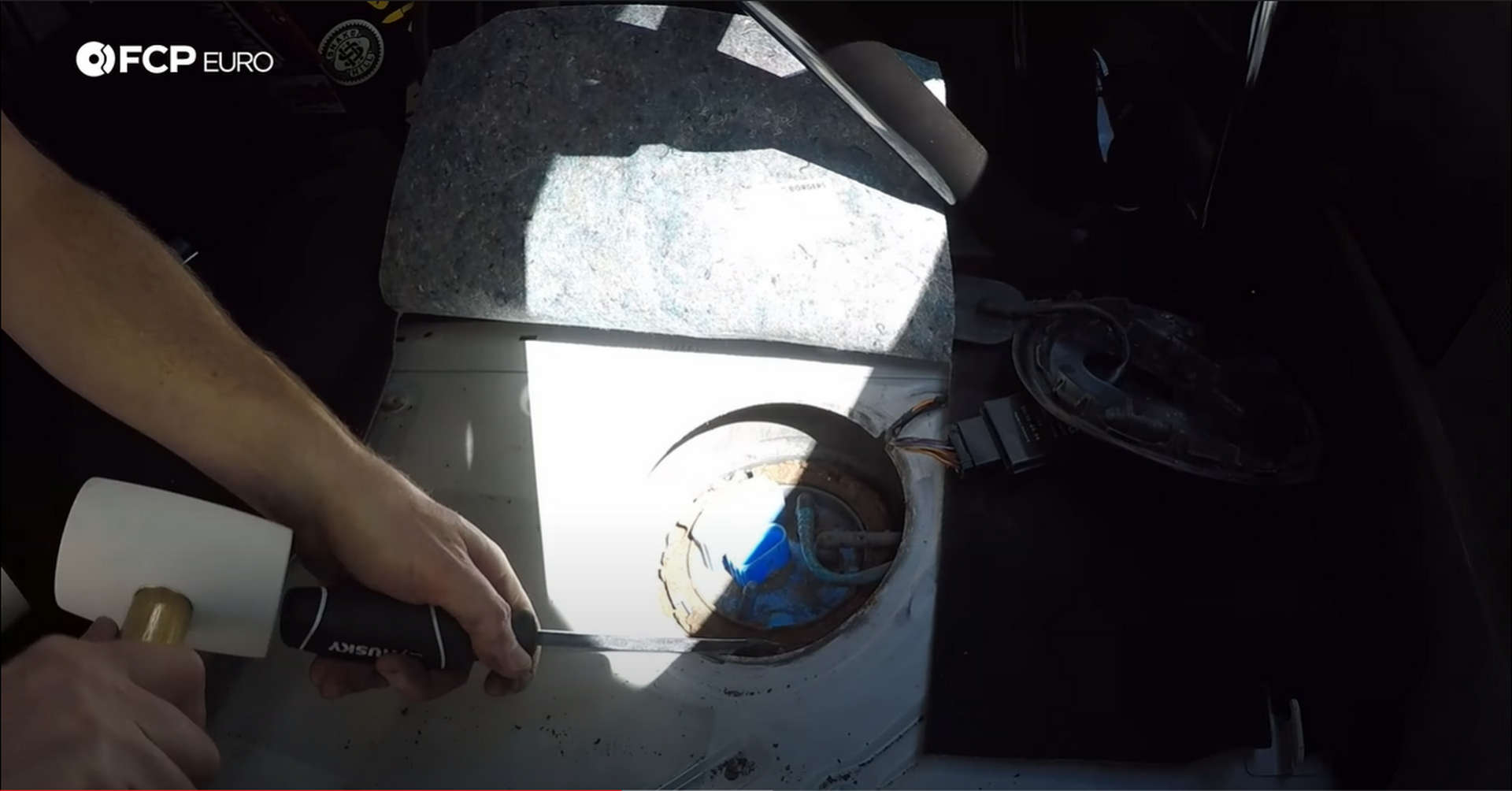 DIY VW GTI Fuel Pump releasing fuel pump assembly locking ring