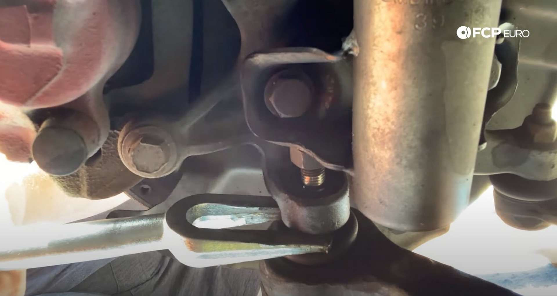 DIY BMW E36 Control Arm and Bushings using the pickle fork to separate the ball joint from the knuckle