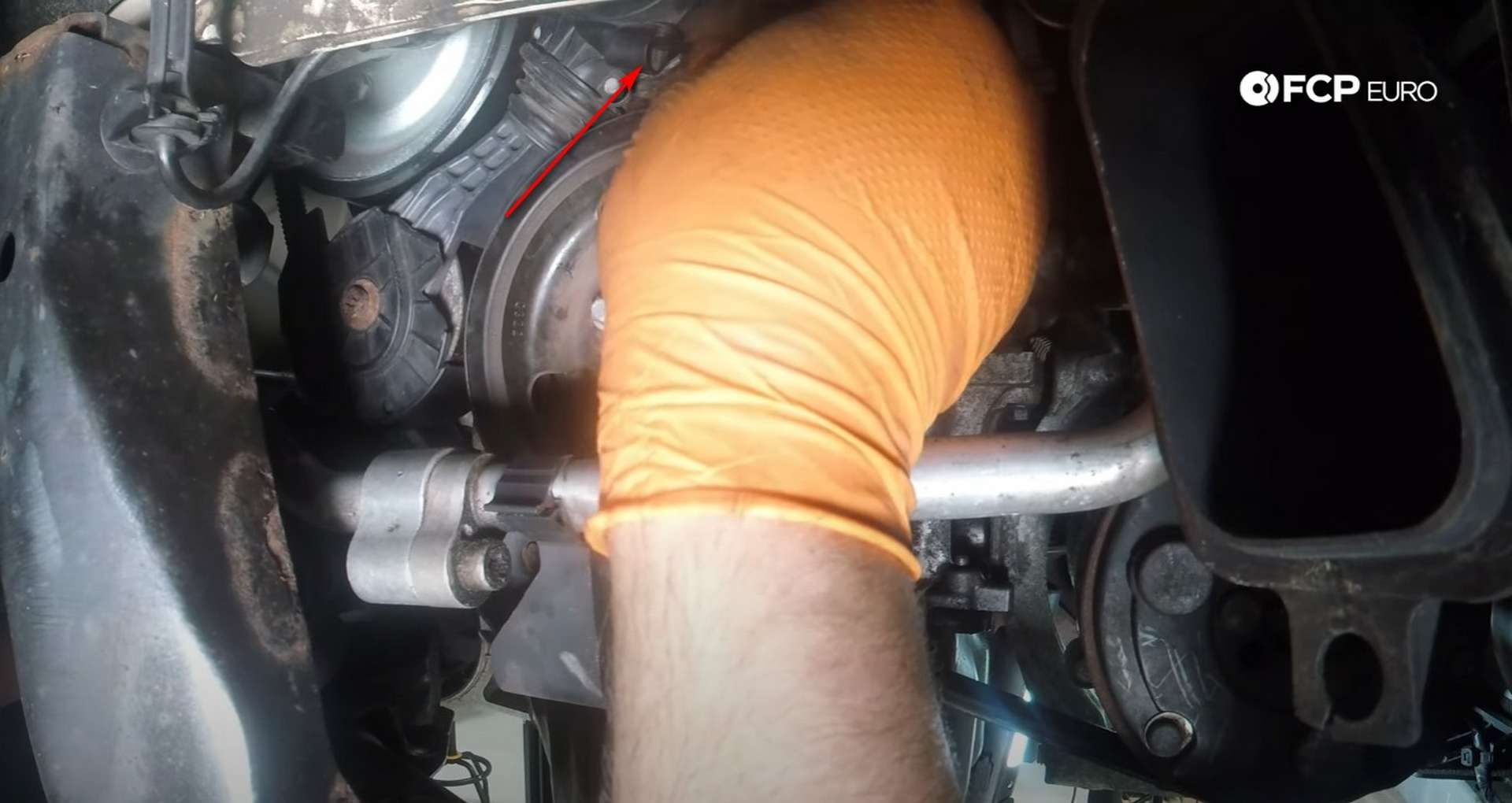 DIY MINI R56 Timing Chain Replacement releasing the tension from the pull tab