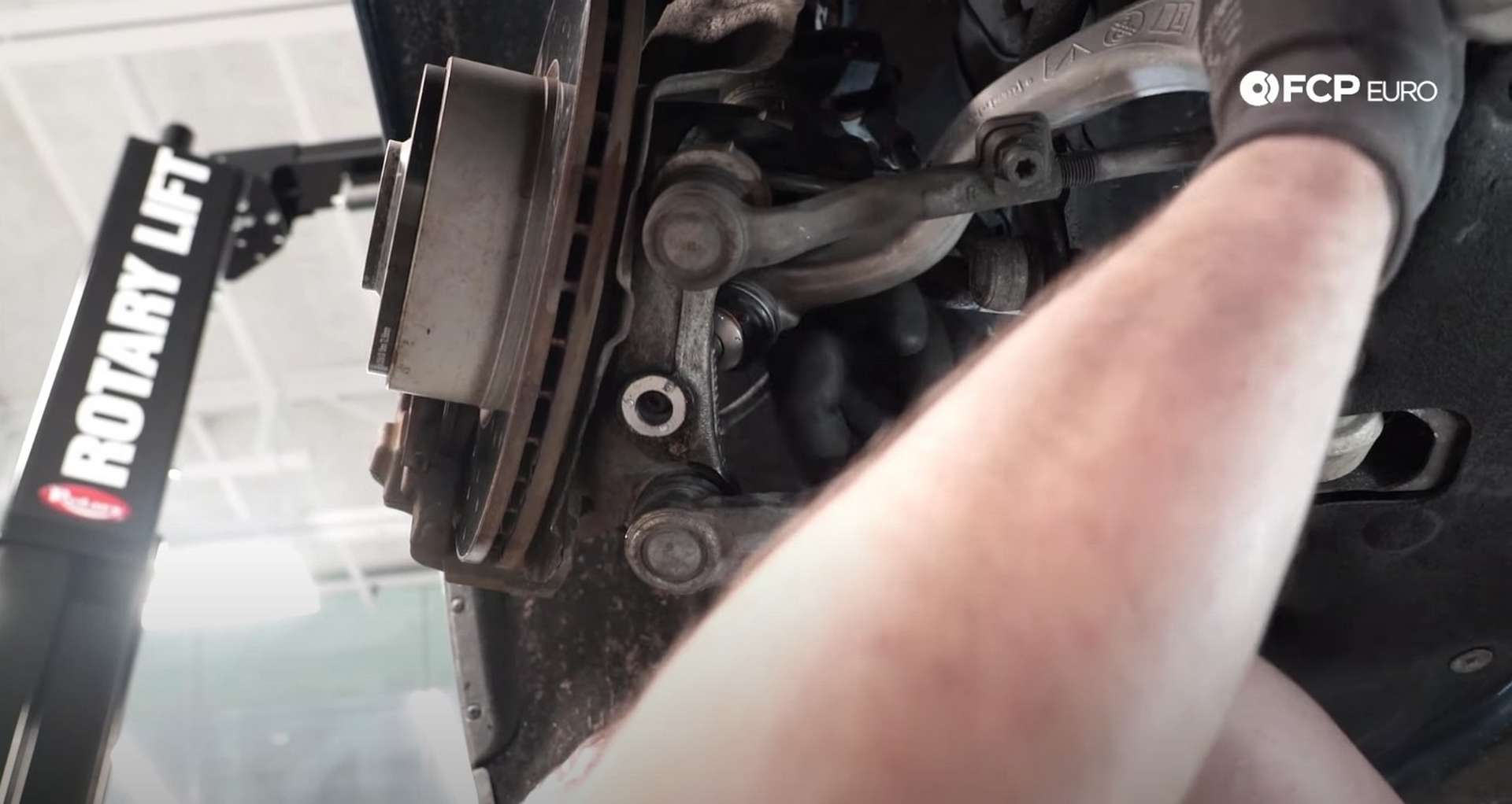 DIY BMW F30 Front Control Arm Replacement removing the thrust arm's mounting bolt