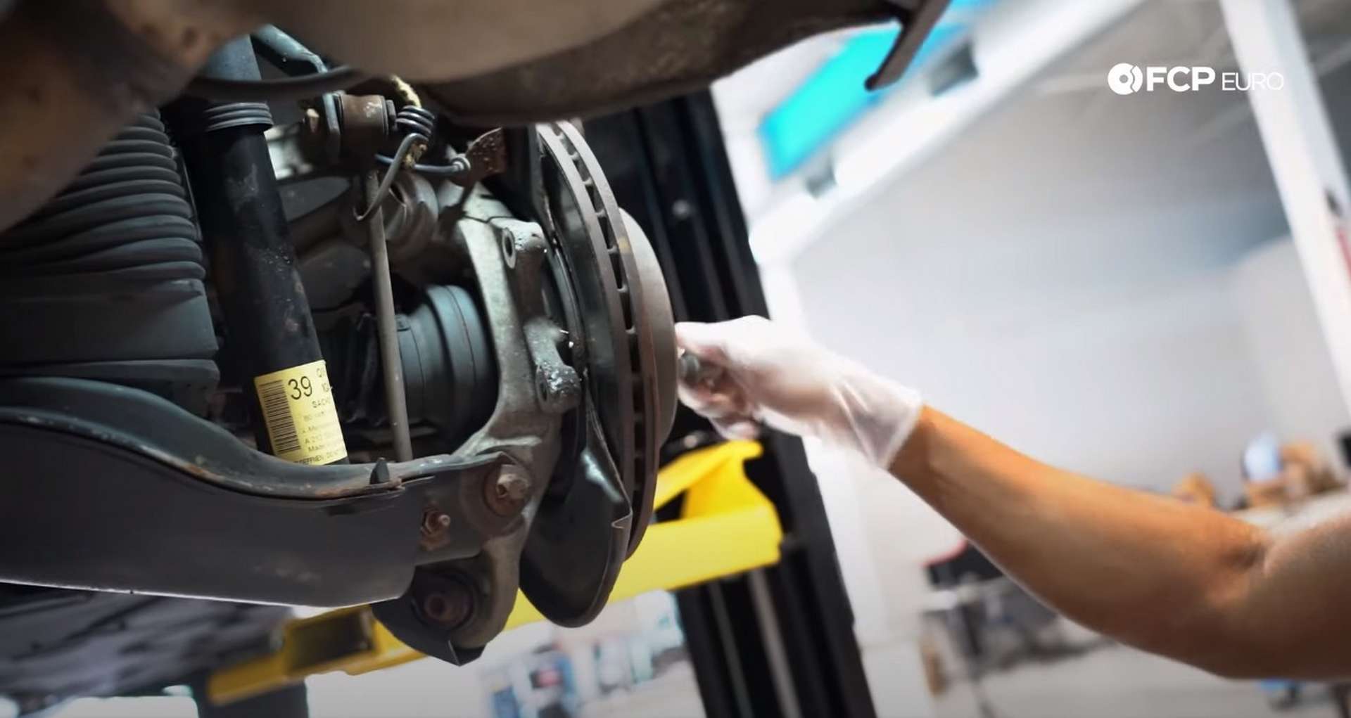 DIY Mercedes W211/212 Rear Brake Job threading in a lug bolt