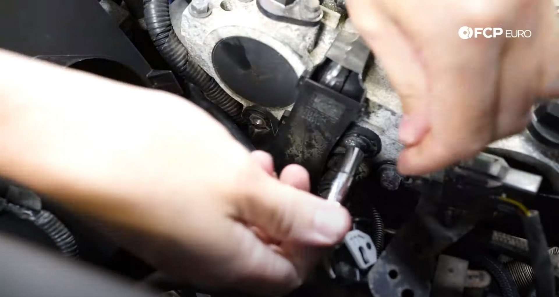 DIY Volvo P1 Timing Belt Replacement removing the ignition coil harness bolts]